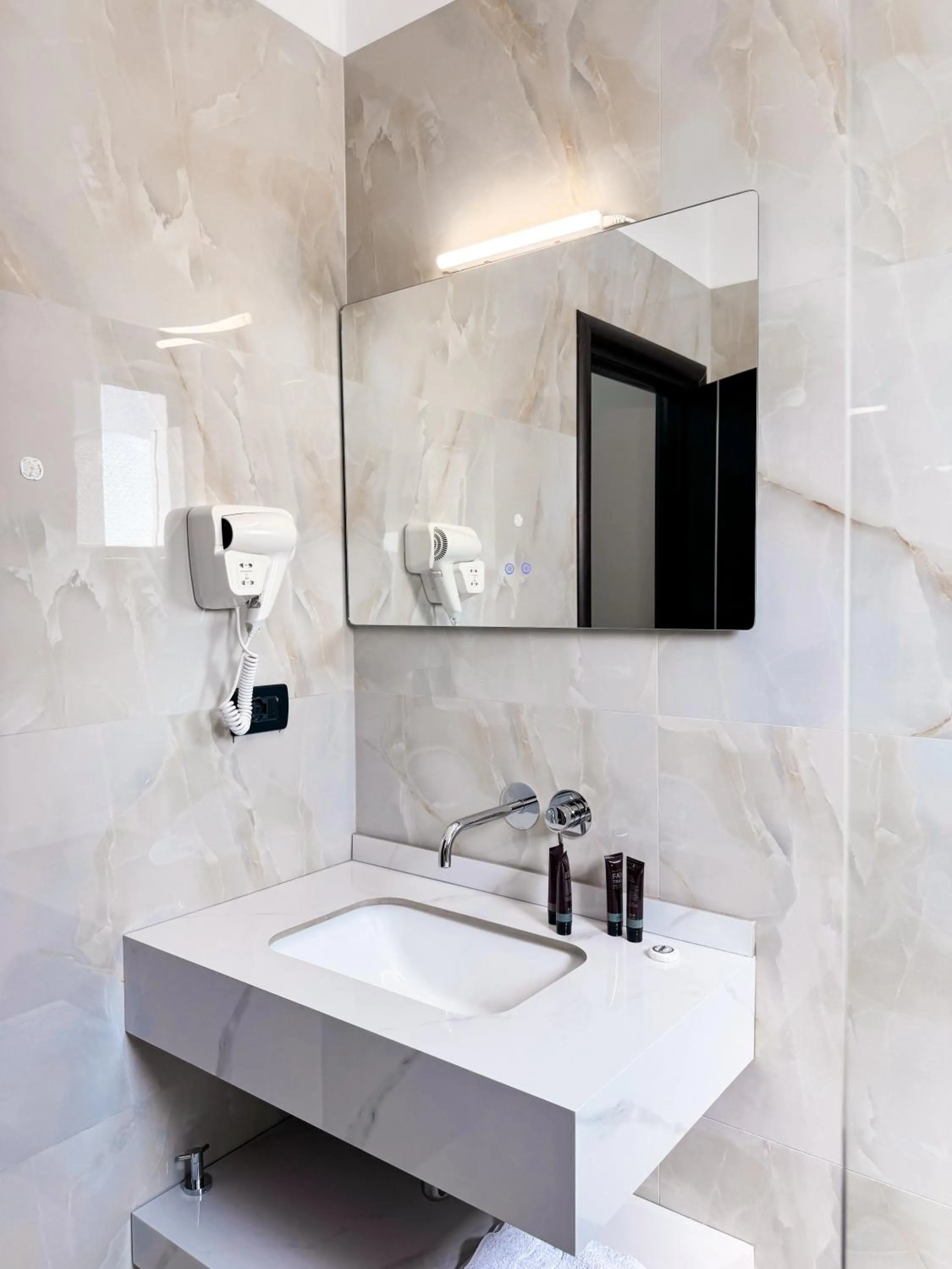 Bathroom in New Heaven Hotel