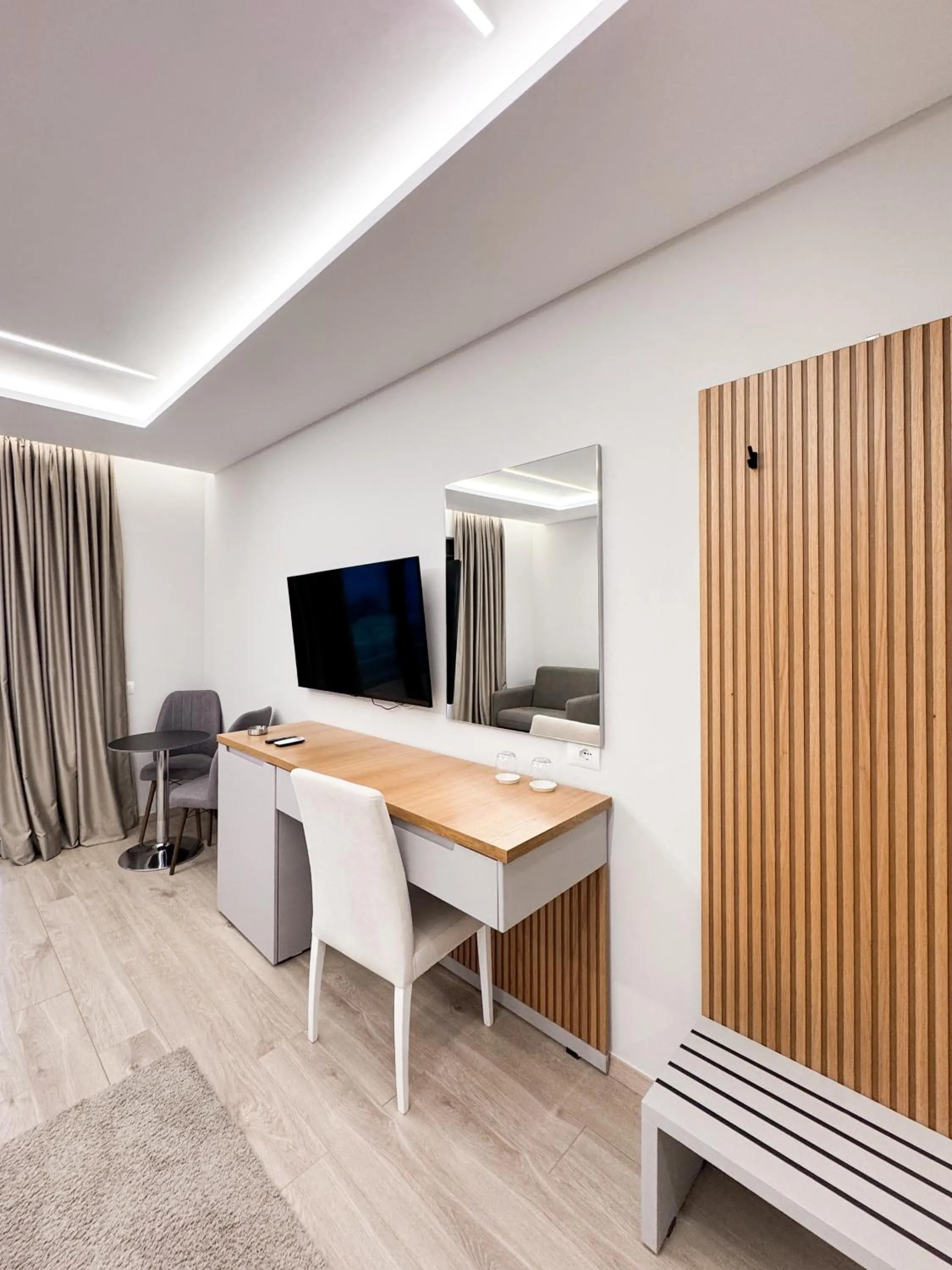 Communal lounge/ TV room in New Heaven Hotel