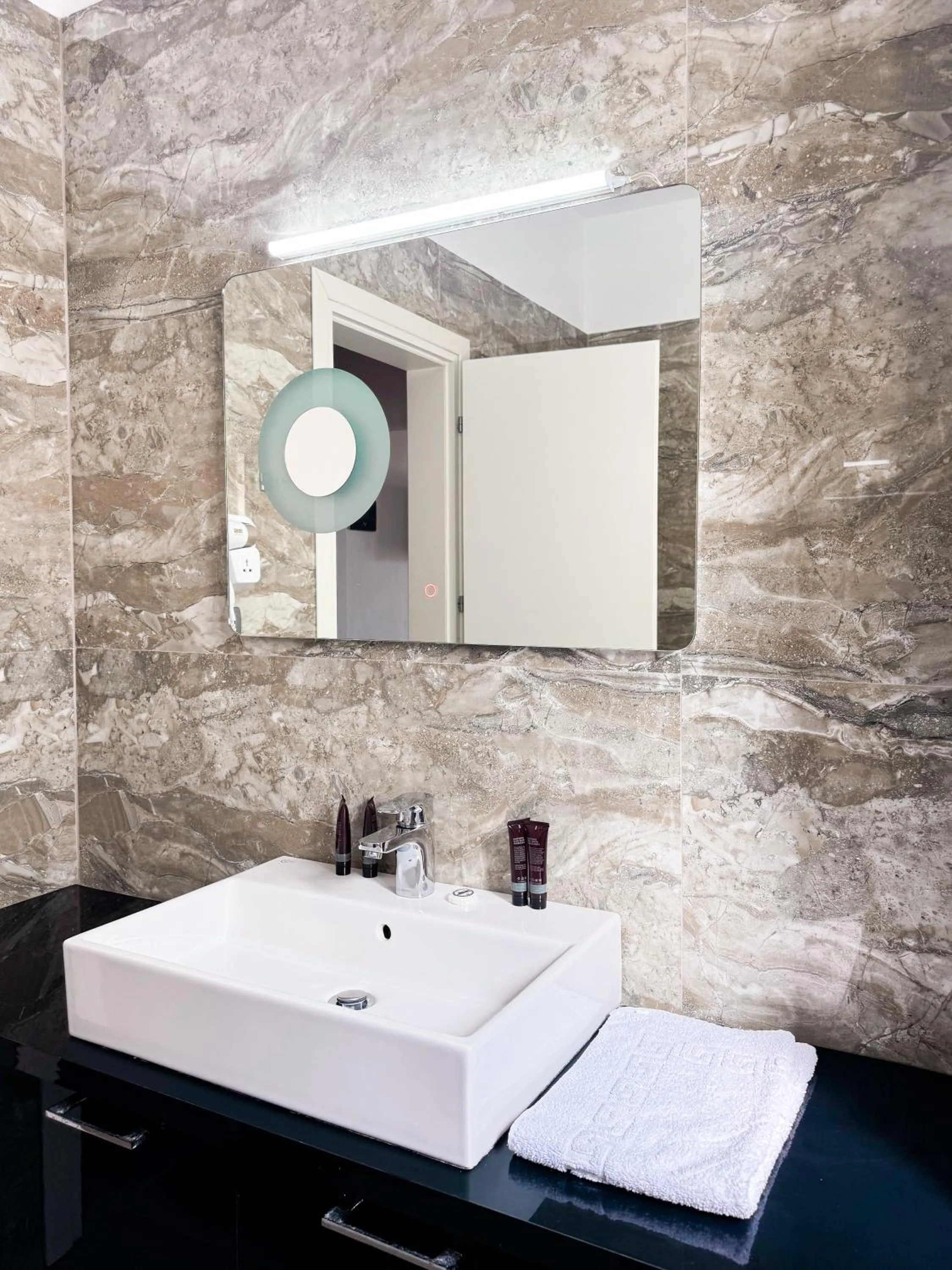 Bathroom in New Heaven Hotel