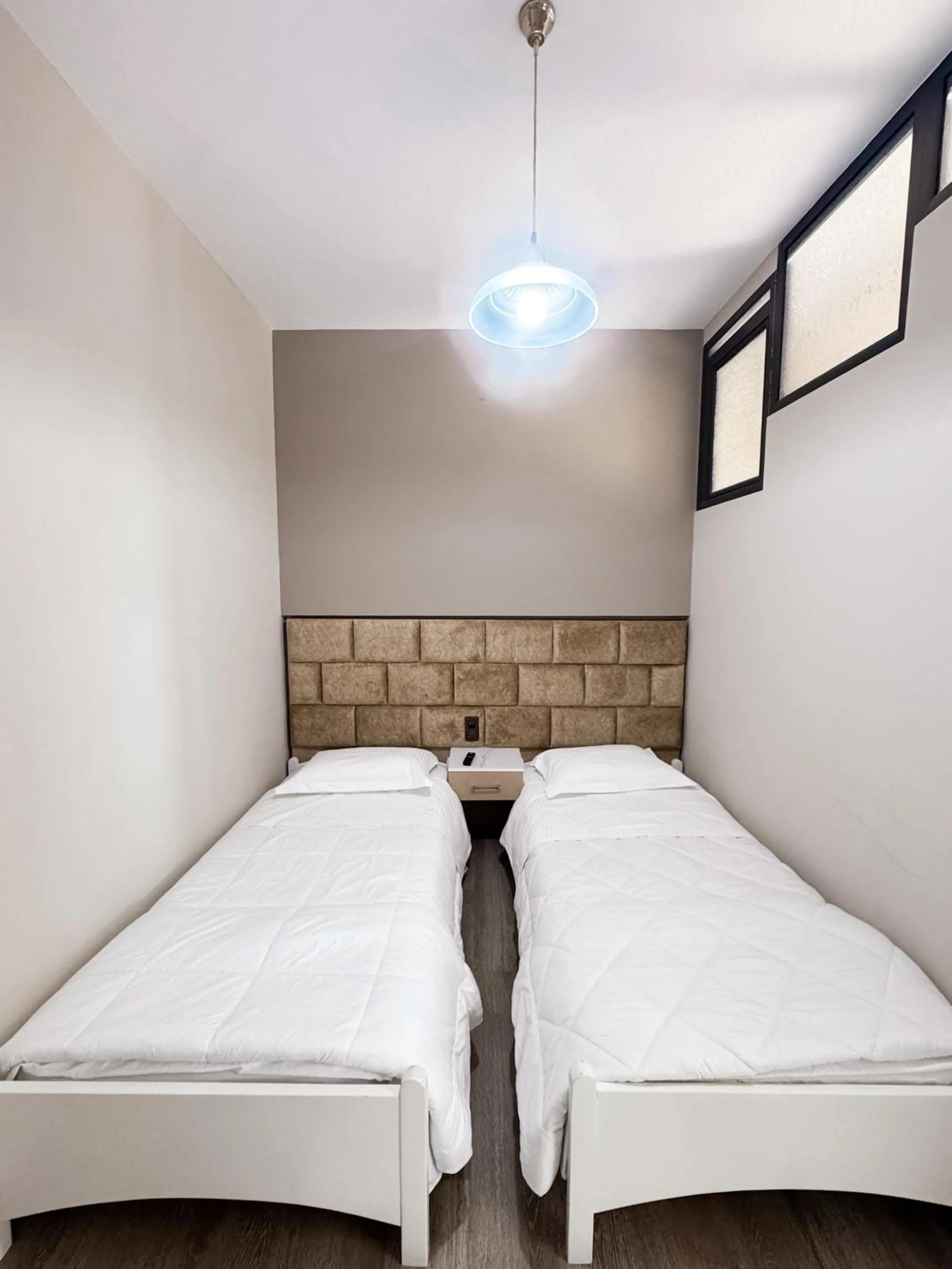 Bed in New Heaven Hotel