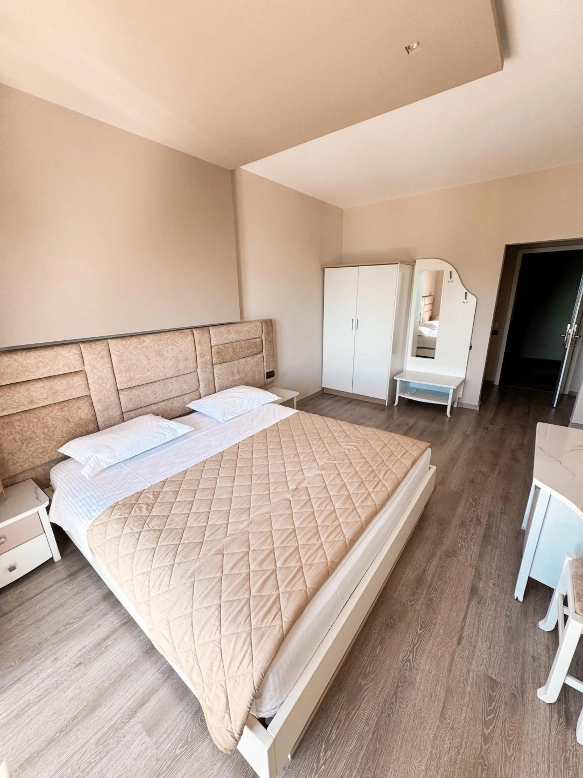 Photo of the whole room, Bed in New Heaven Hotel