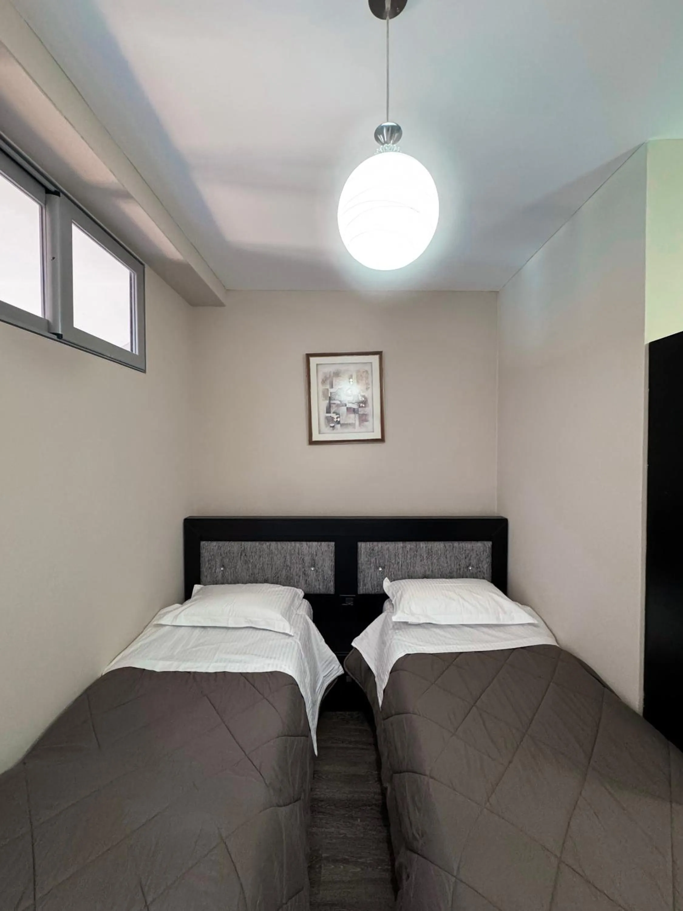 Bed in New Heaven Hotel
