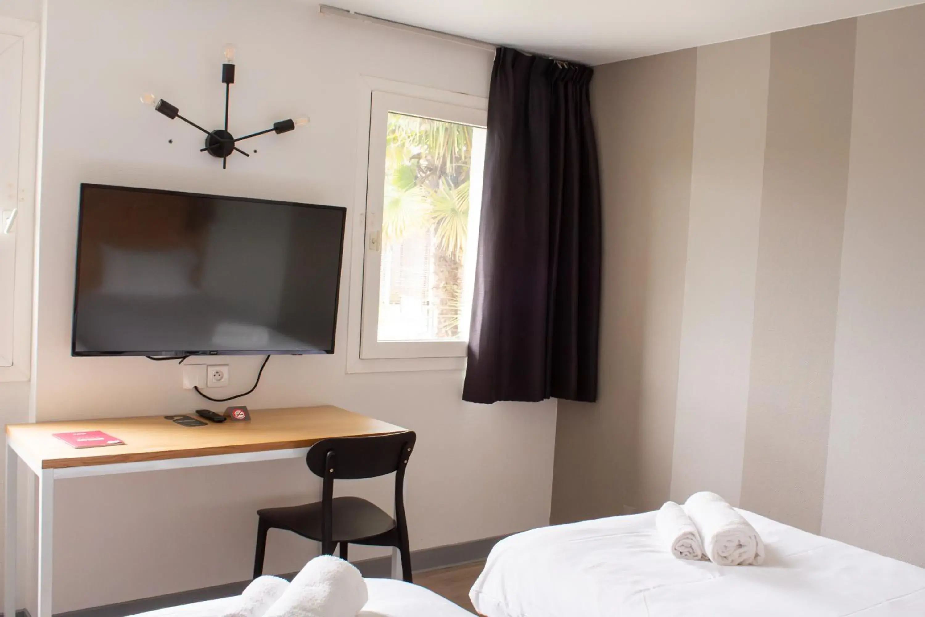 Photo of the whole room, Bed in Hôtel Les Genêts Bayonne Photo of the whole room, Bed in Hôtel Les Genêts Bayonne