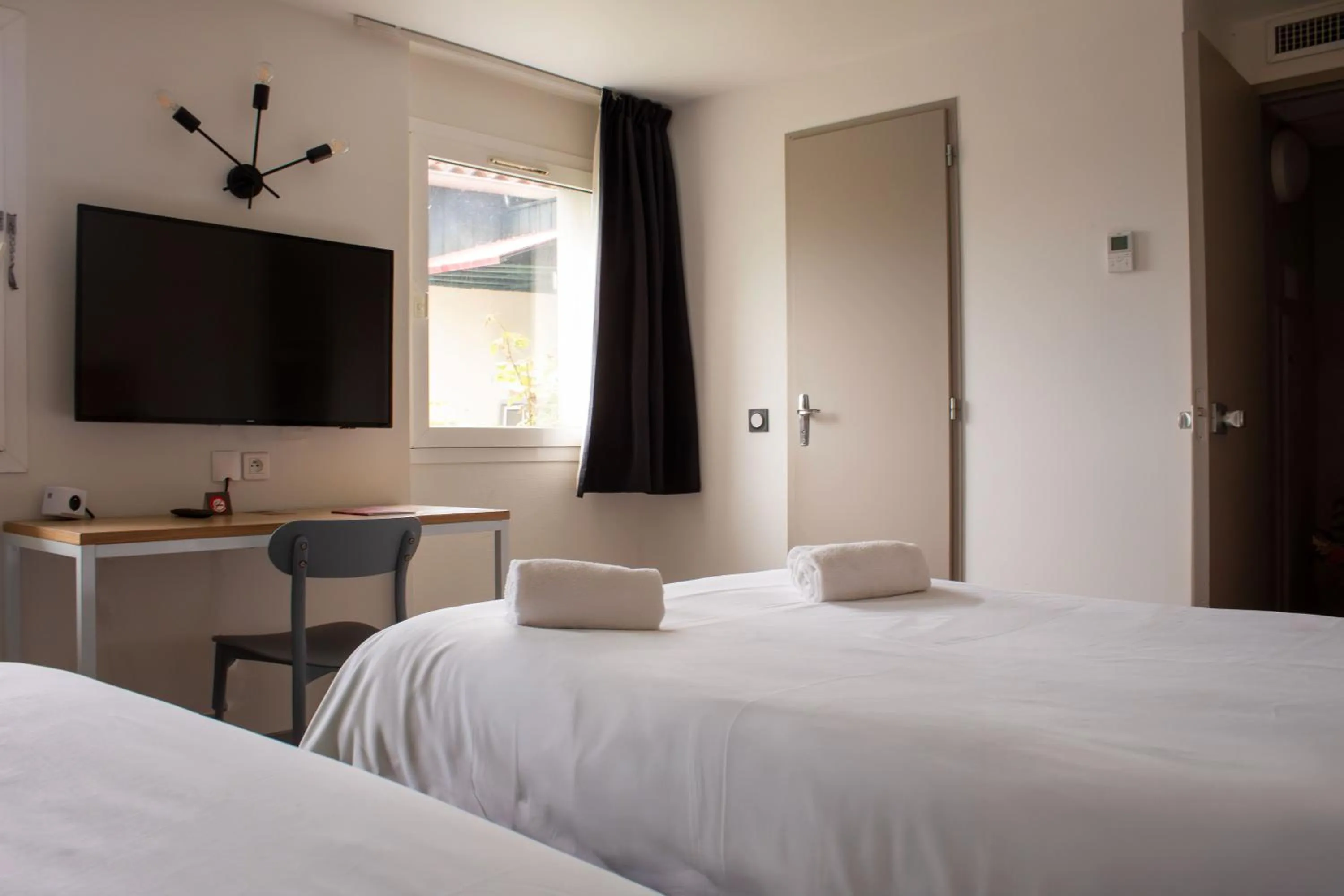 TV and multimedia, Bed in Hôtel Les Genêts Bayonne