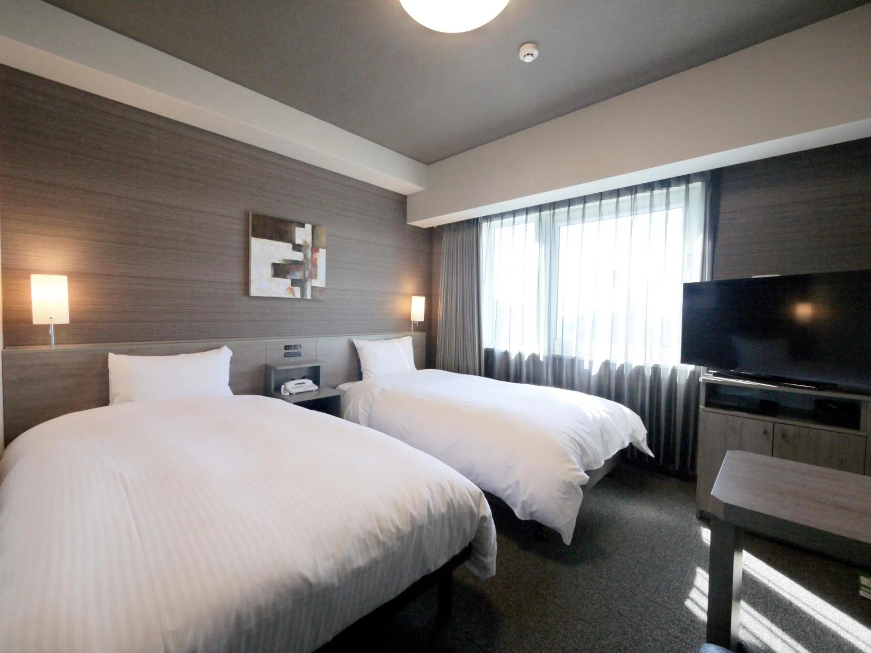 Photo of the whole room, Bed in Hotel Route-Inn Osaka Kishiwada -Higashikishiwada Ekimae Kansai Airport-