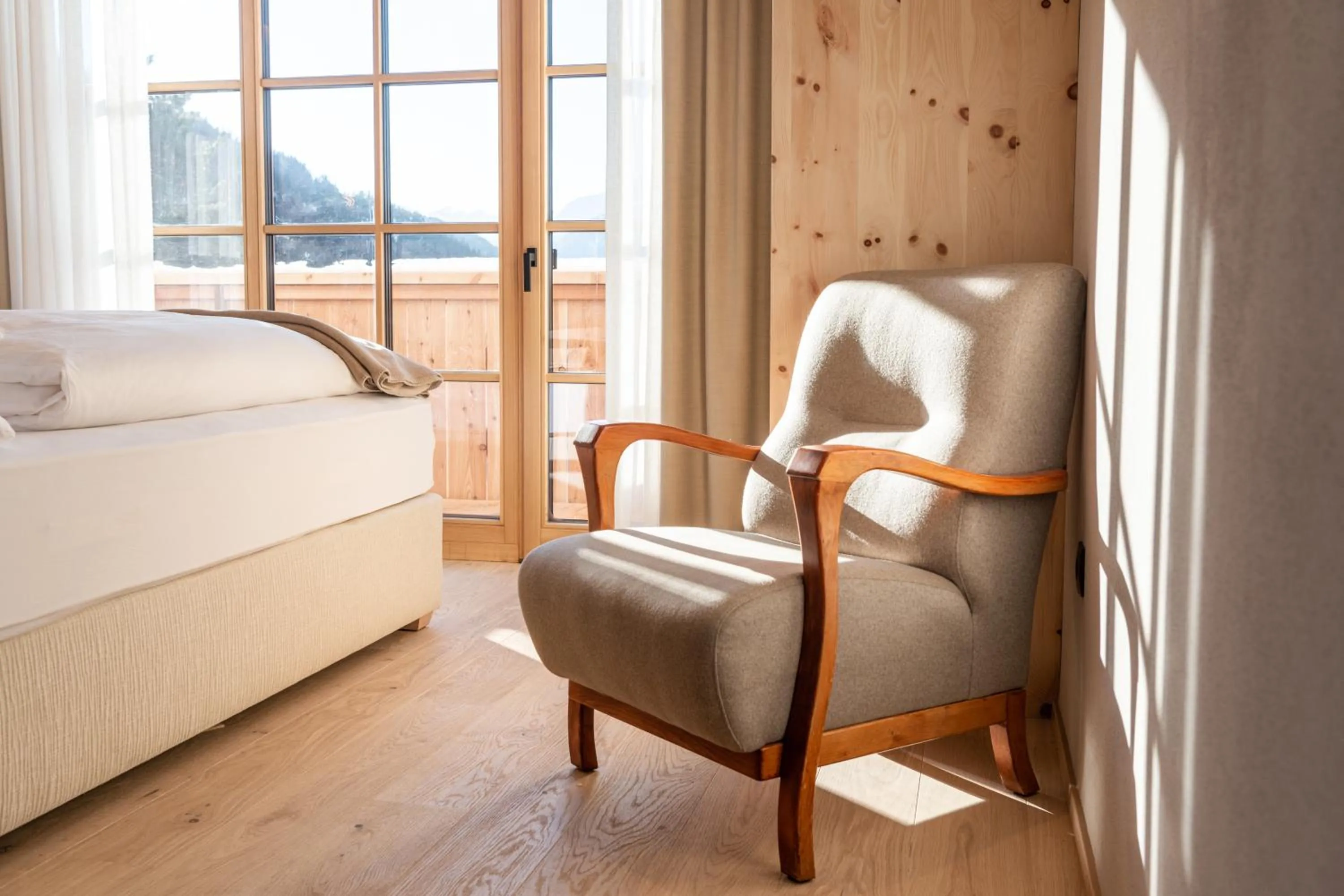 Seating area, Bed in Penserhof - Alpine Hotel & Restaurant