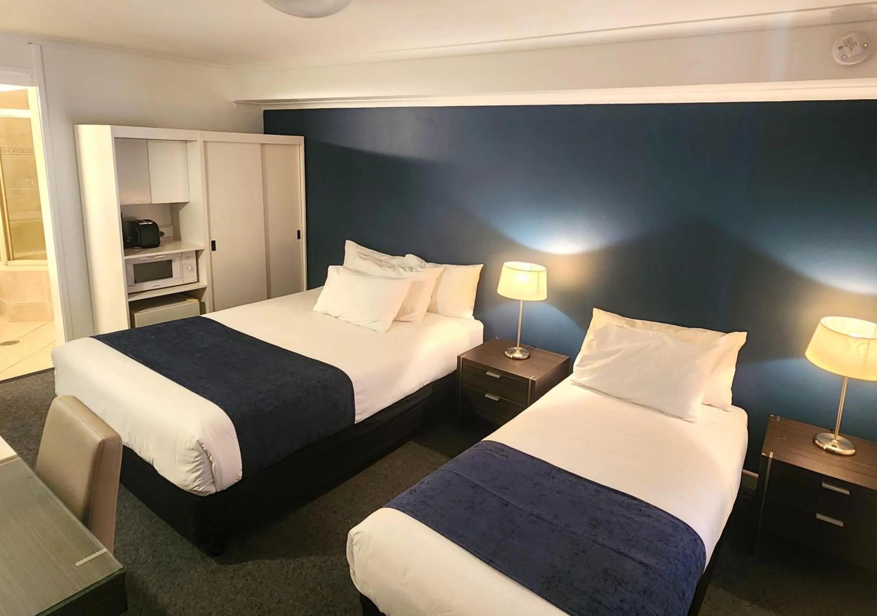 Bed in Golden Age Motor Inn