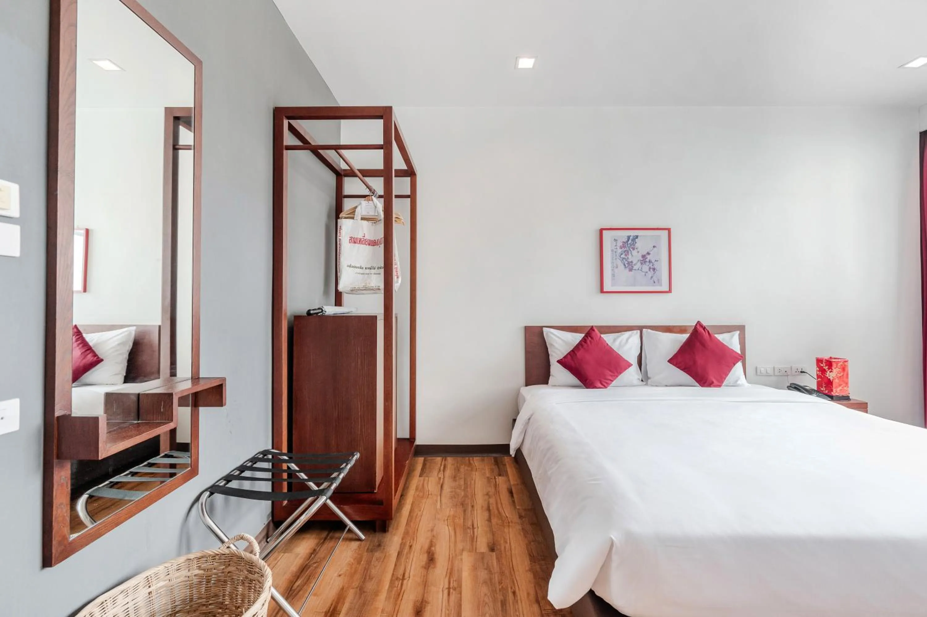 Bed in Ruamchitt Plaza Hotel