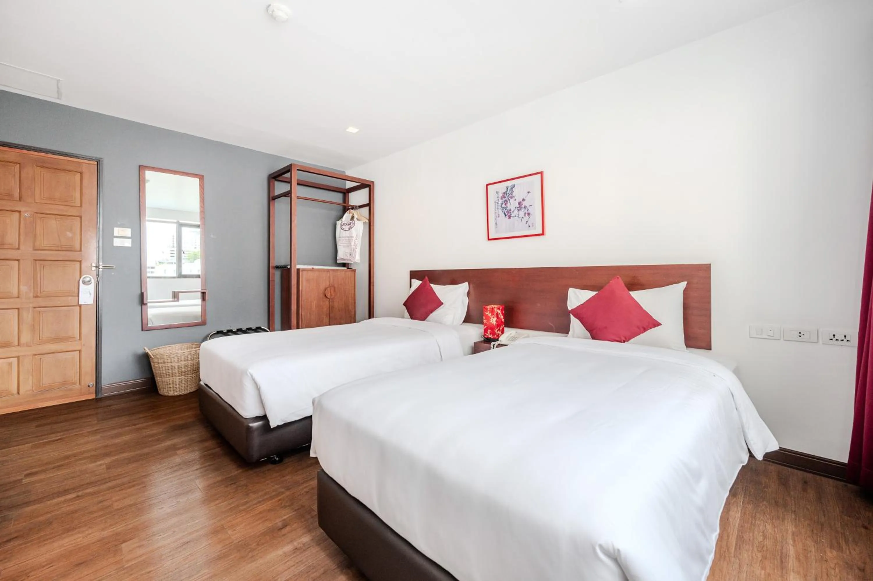 Bed in Ruamchitt Plaza Hotel