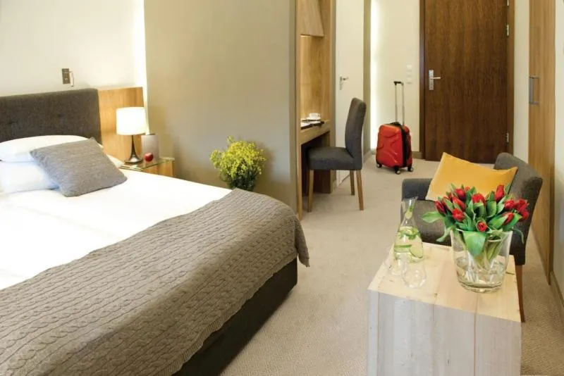 Bed in Uroczysko Siedmiu Stawów & Spa by L'Occitane