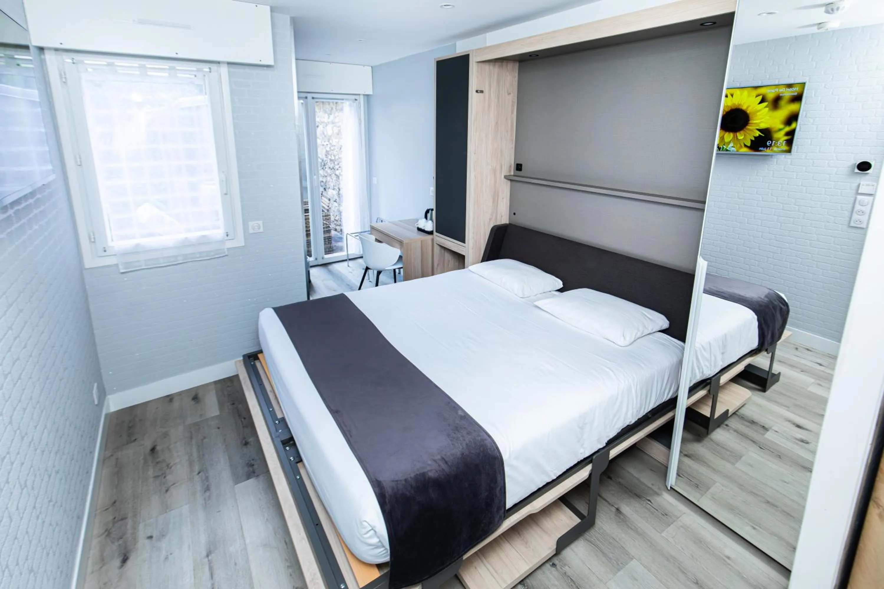 Photo of the whole room, Bed in HOTEL DE PARIS MONTPARNASSE