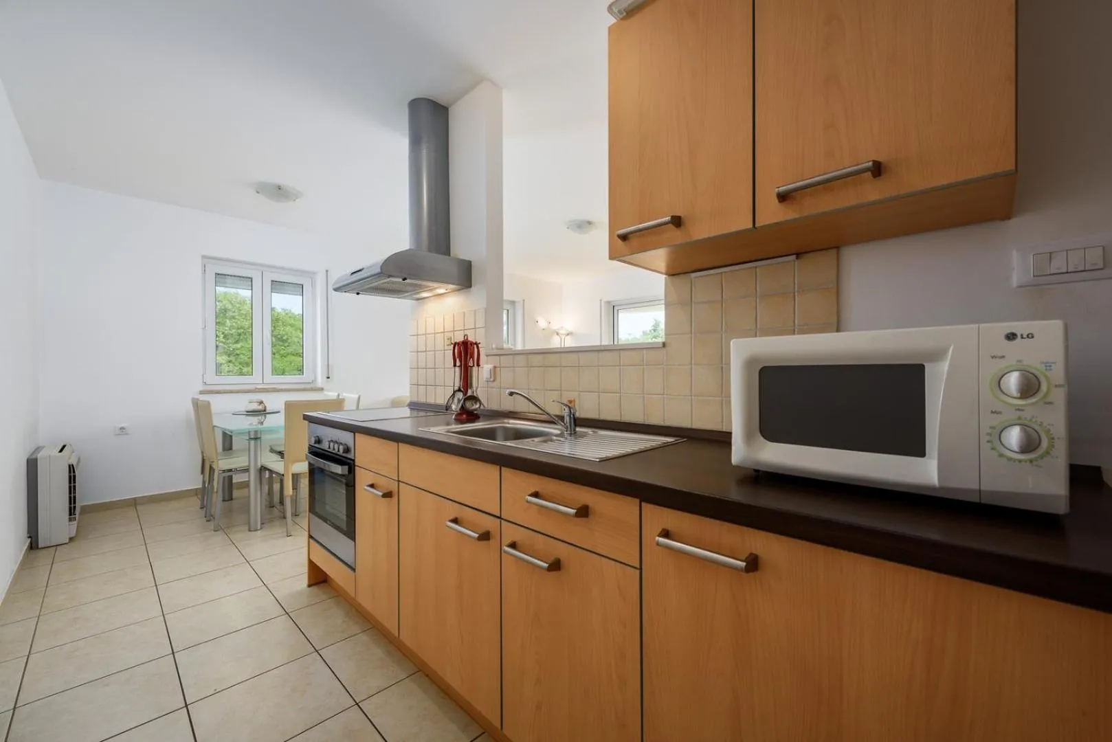 Kitchen or kitchenette in Adria Apartments