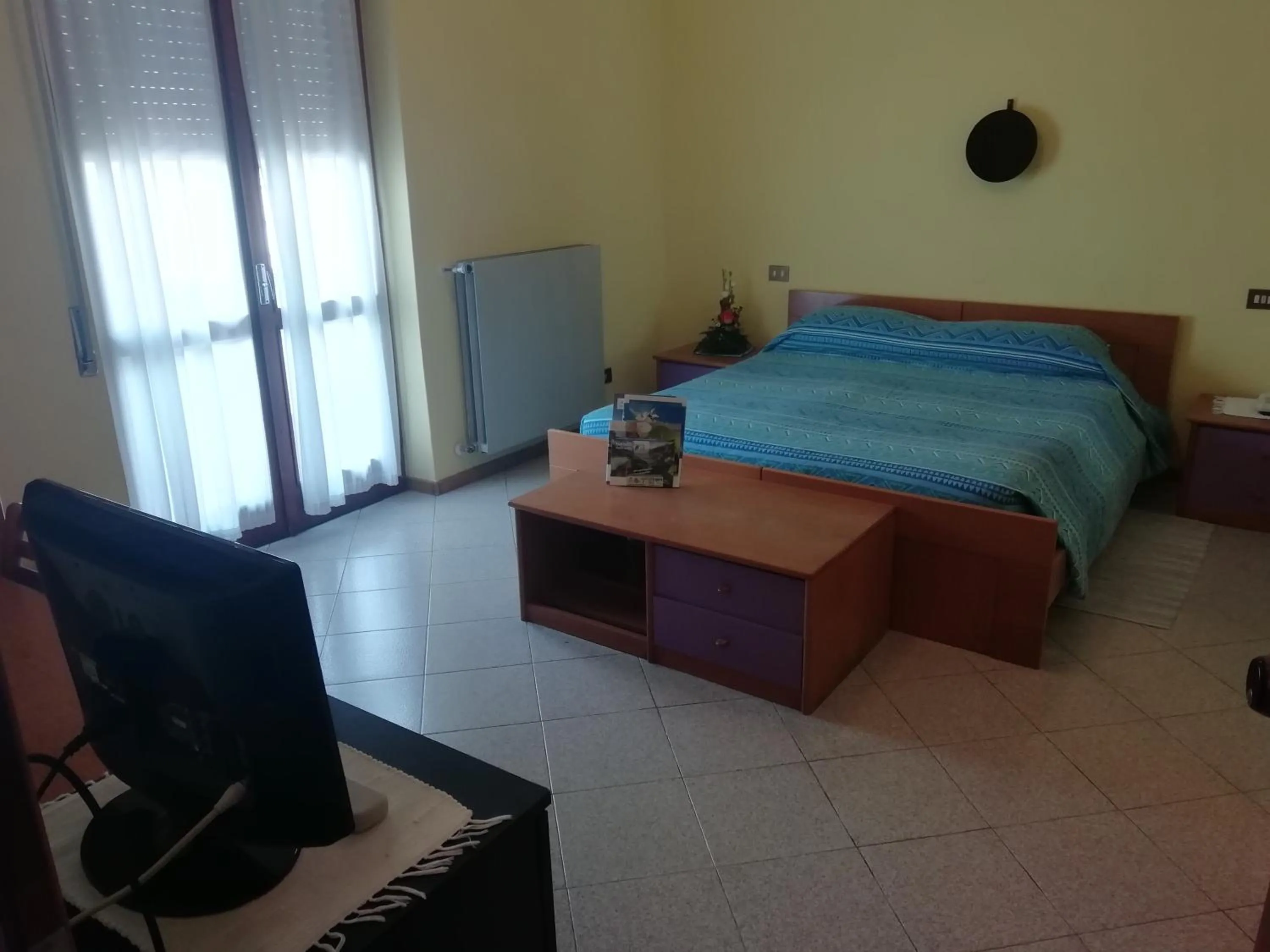 Bed in Hotel Rezia Valtellina