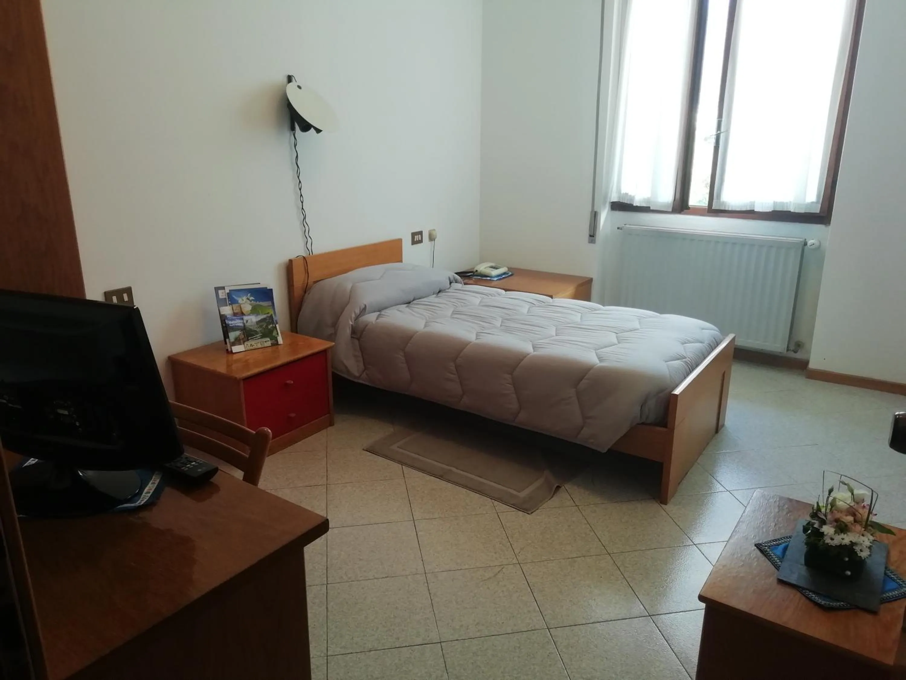 Bed in Hotel Rezia Valtellina