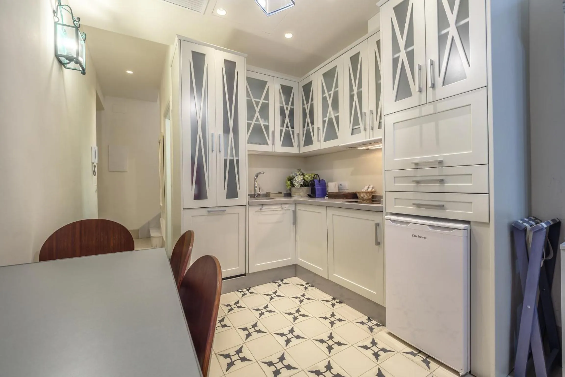 Kitchen or kitchenette in ApartaSuites Alberca Deluxe