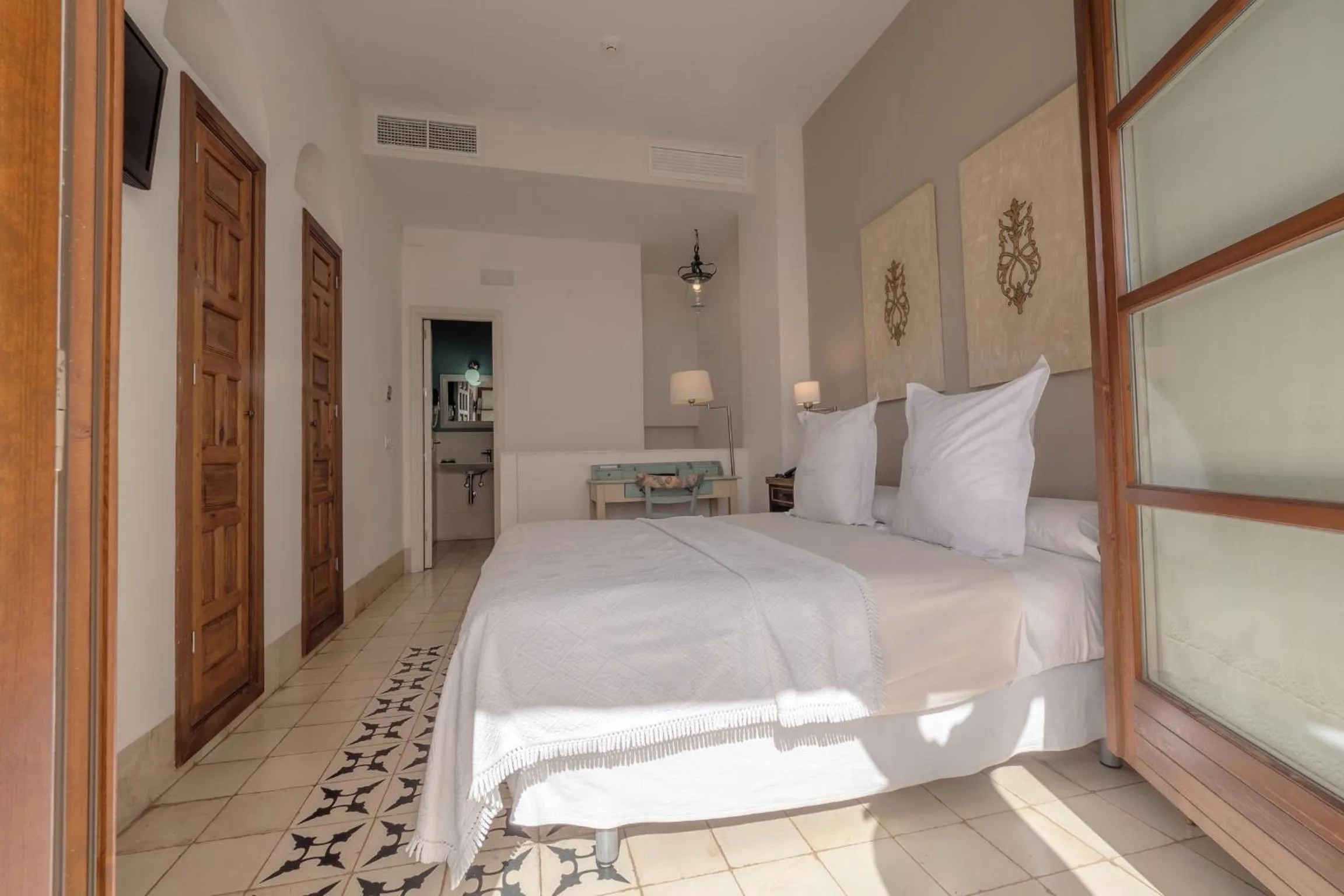 Bed in ApartaSuites Alberca Deluxe