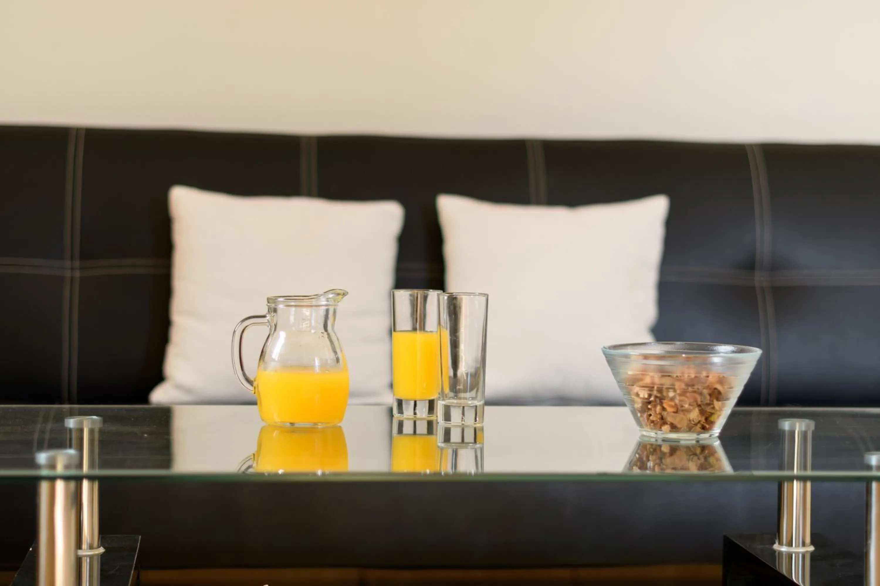 Bed in Moonlight Apartments & Suites