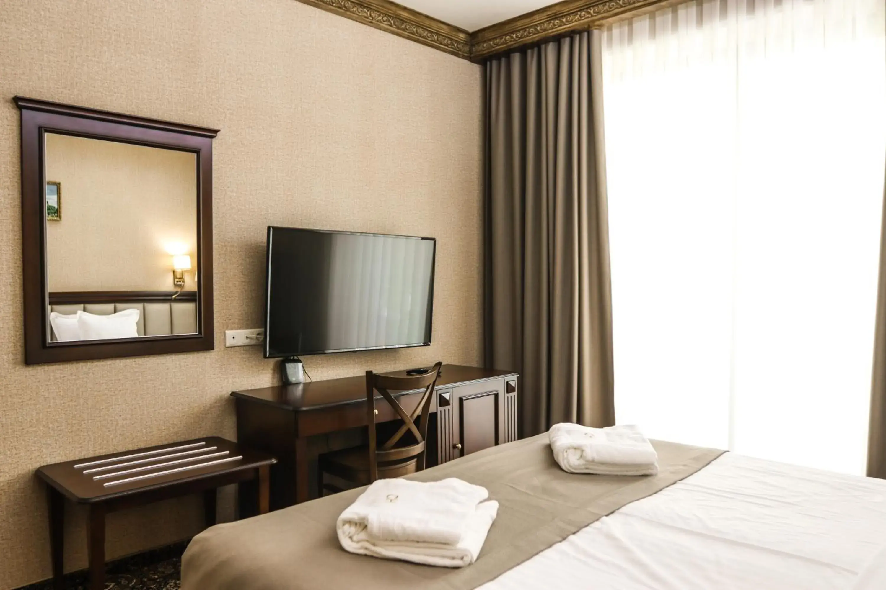 Communal lounge/ TV room, Bed in Konyak Hotel Communal lounge/ TV room, Bed in Konyak Hotel