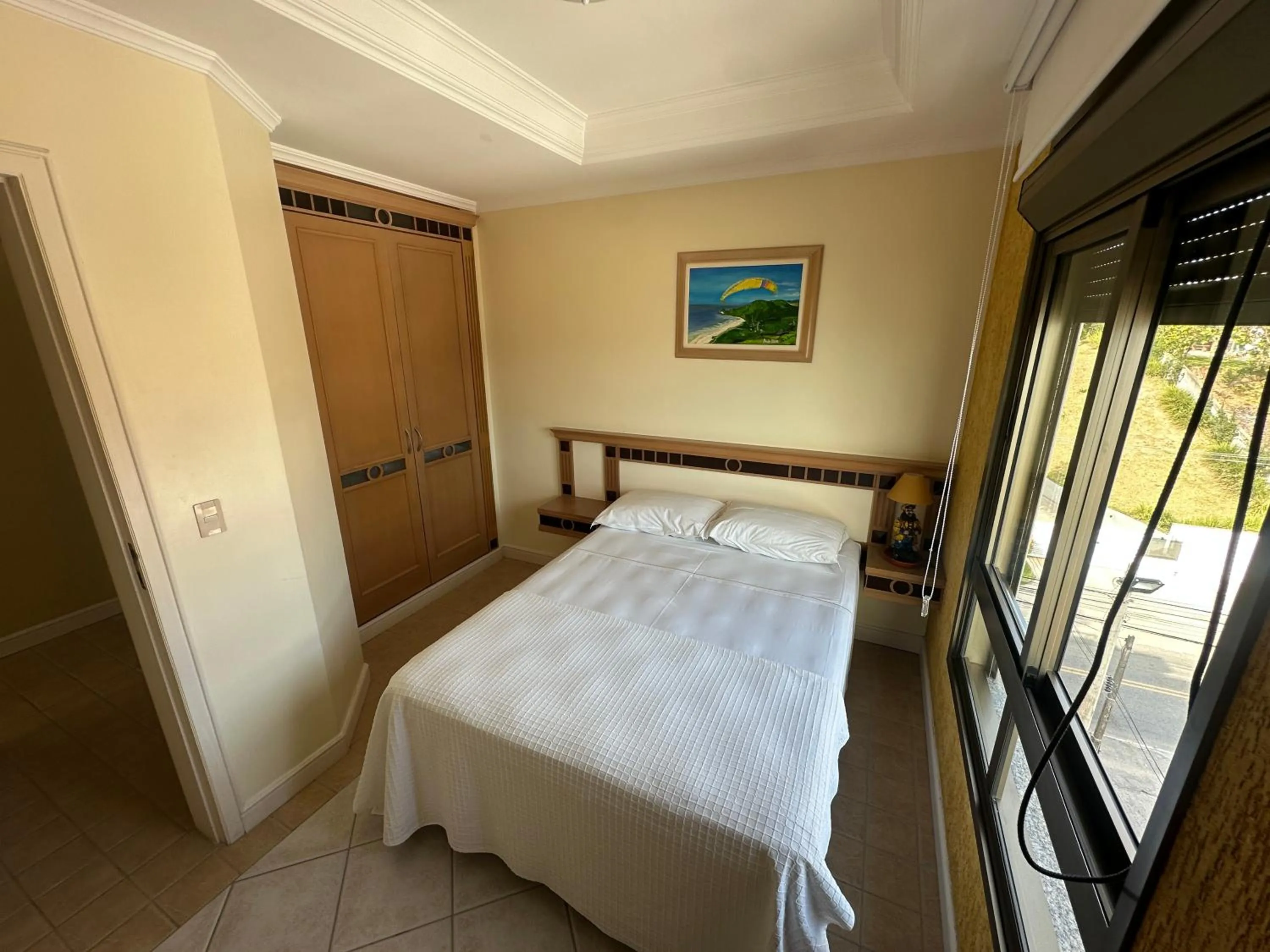 Bed in Golfinhos Apart Hotel