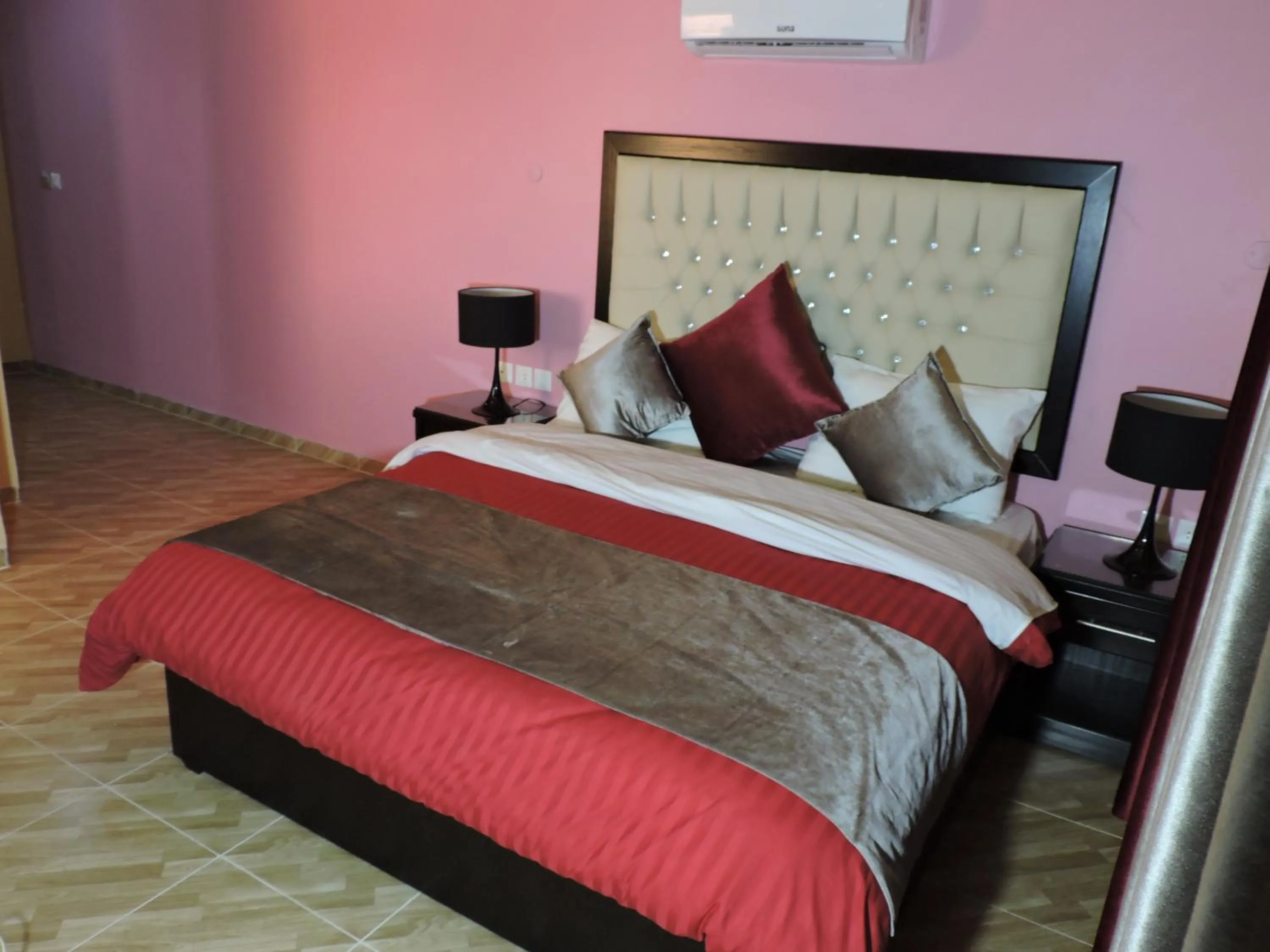 Bed in Valentine Inn Luxury