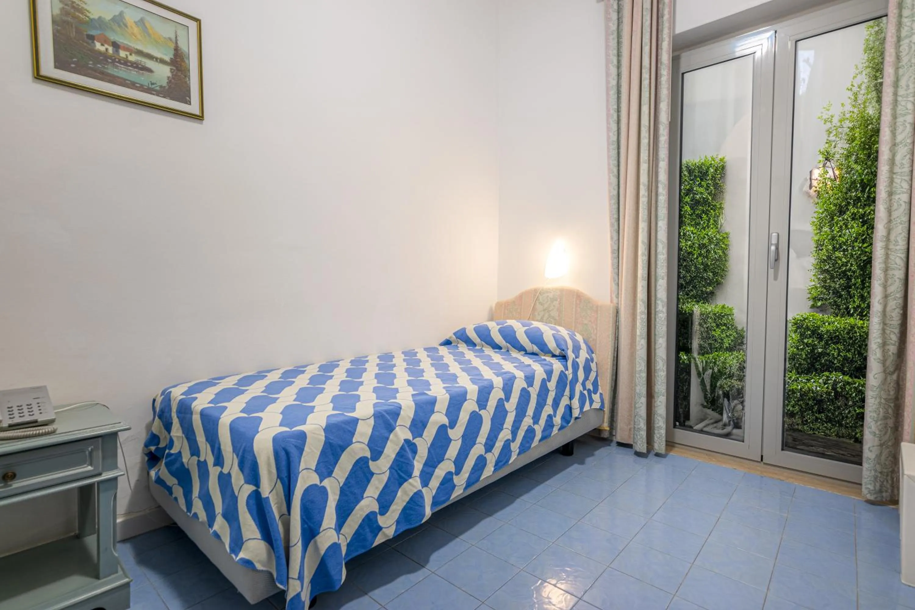 Bed in Hotel Poseidon