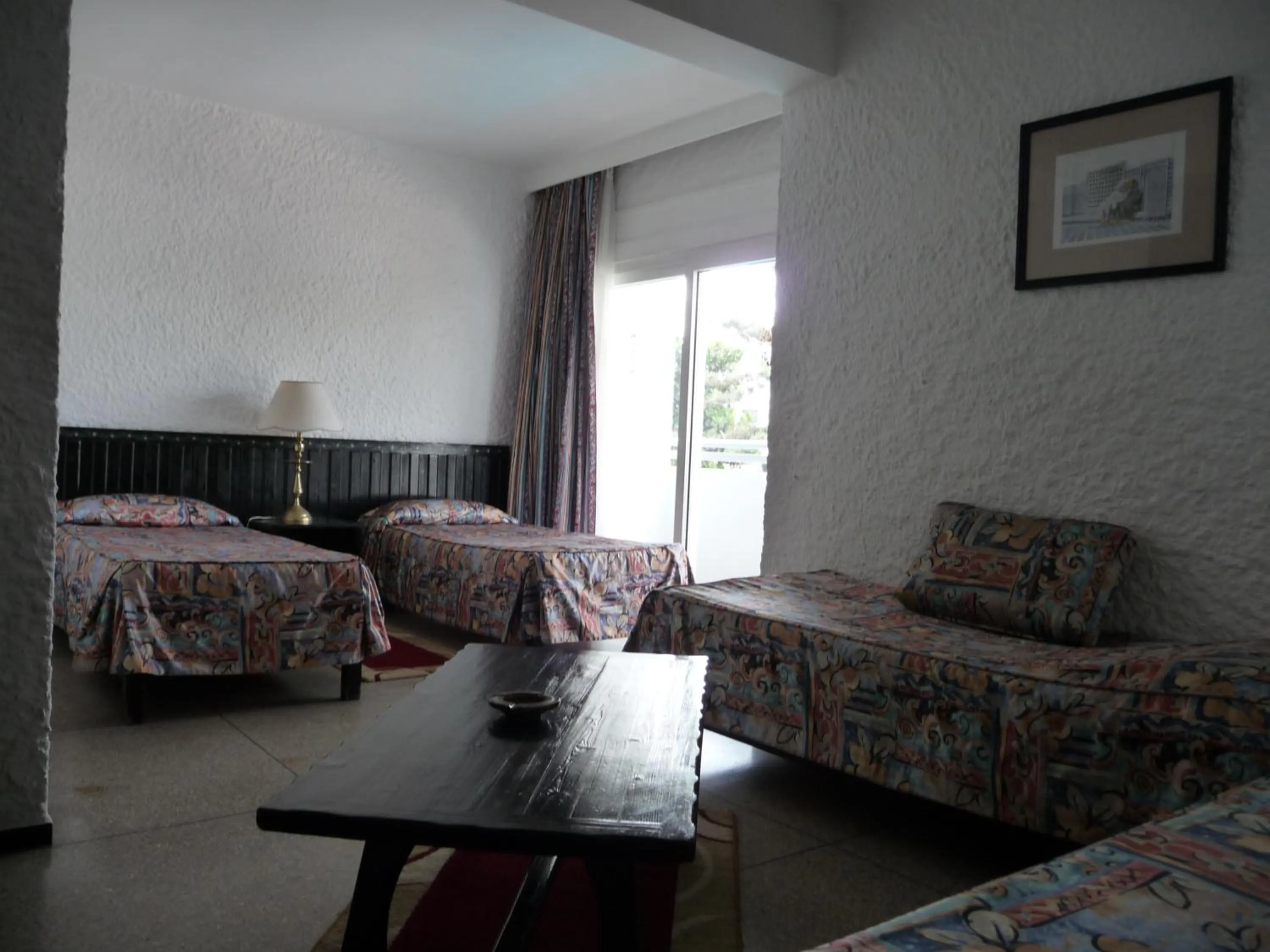 Bed in HOTEL KAMAL CITY CENTER