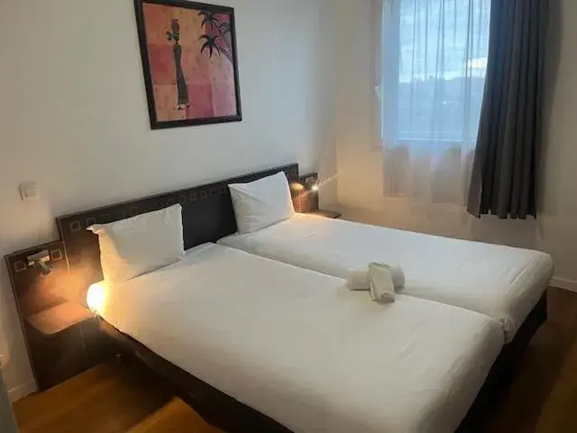 Bed in Aparthotel Adagio Access Paris Porte De Charenton Bed in Aparthotel Adagio Access Paris Porte De Charenton