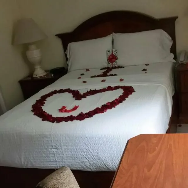 Bed in Micro Hotel Condo Suites