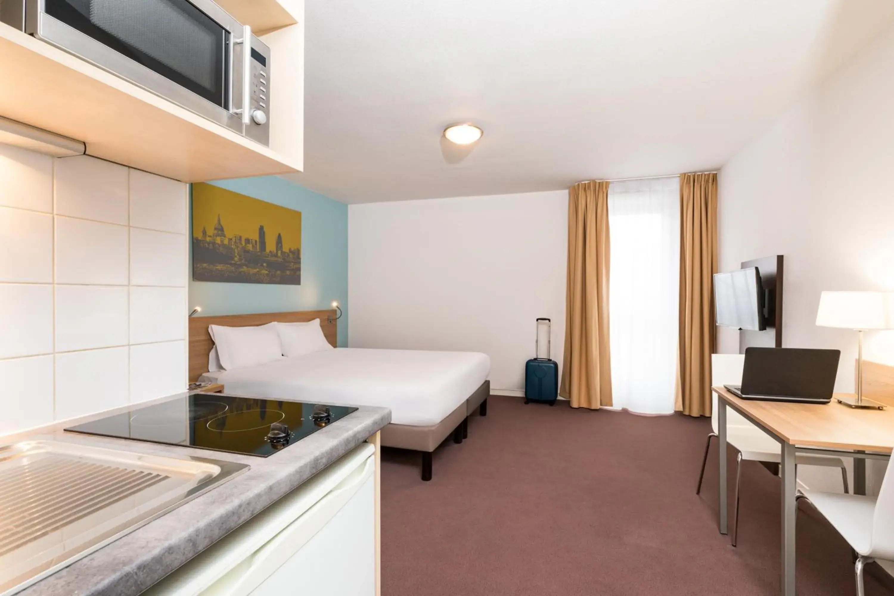 Kitchen or kitchenette, Bed in Aparthotel Adagio Access Paris Clamart Kitchen or kitchenette, Bed in Aparthotel Adagio Access Paris Clamart