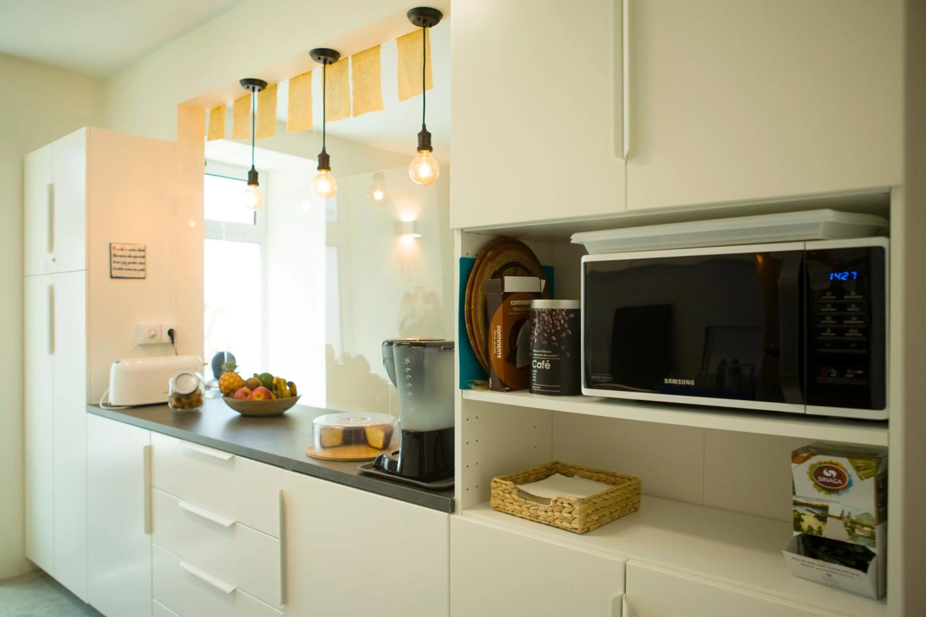 Communal kitchen in THE HOLY COW - Hostel & Suites