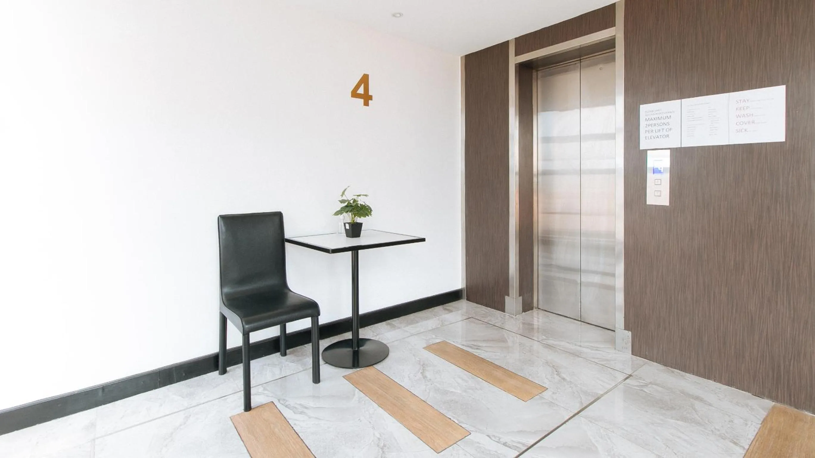 Seating area in RedDoorz Plus at MM Hotel Las Pinas former RedDoorz Plus Near Bamboo Organ