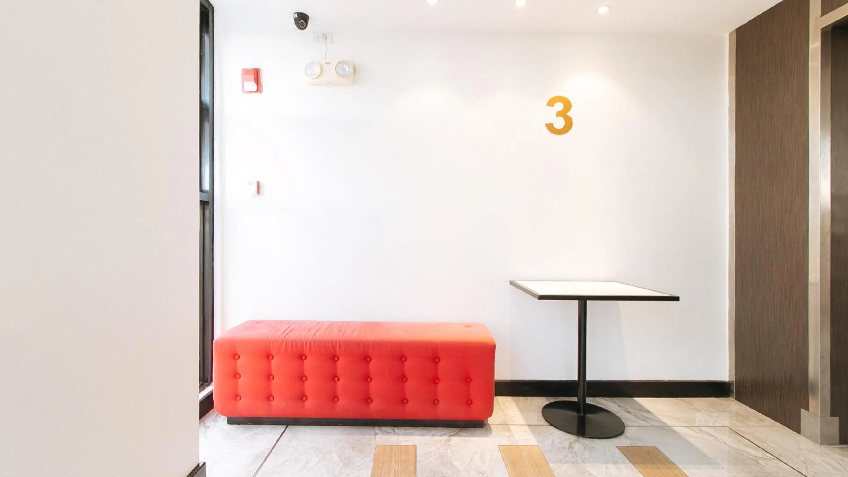 Seating area in RedDoorz Plus at MM Hotel Las Pinas former RedDoorz Plus Near Bamboo Organ