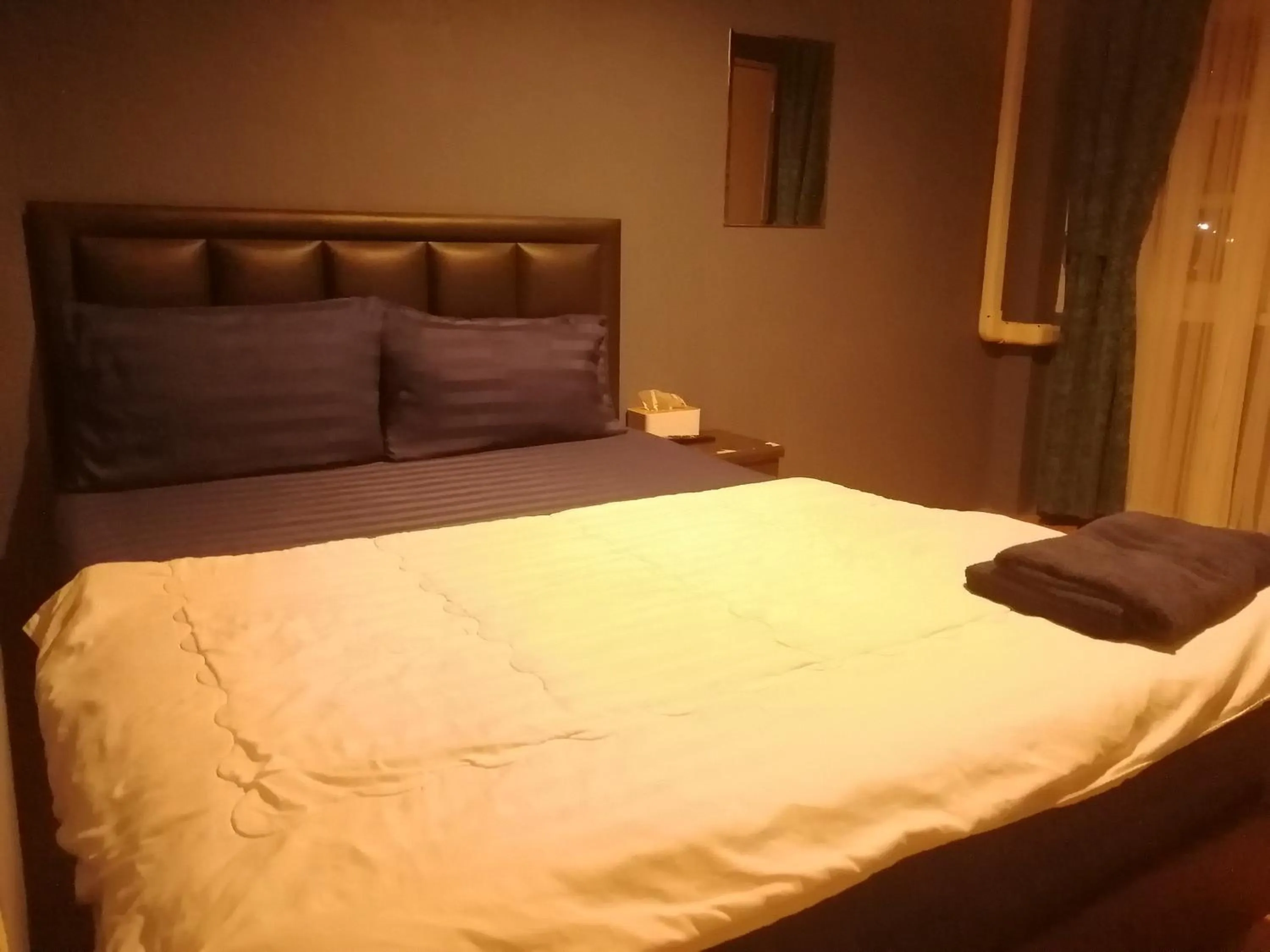 Photo of the whole room, Bed in airport house