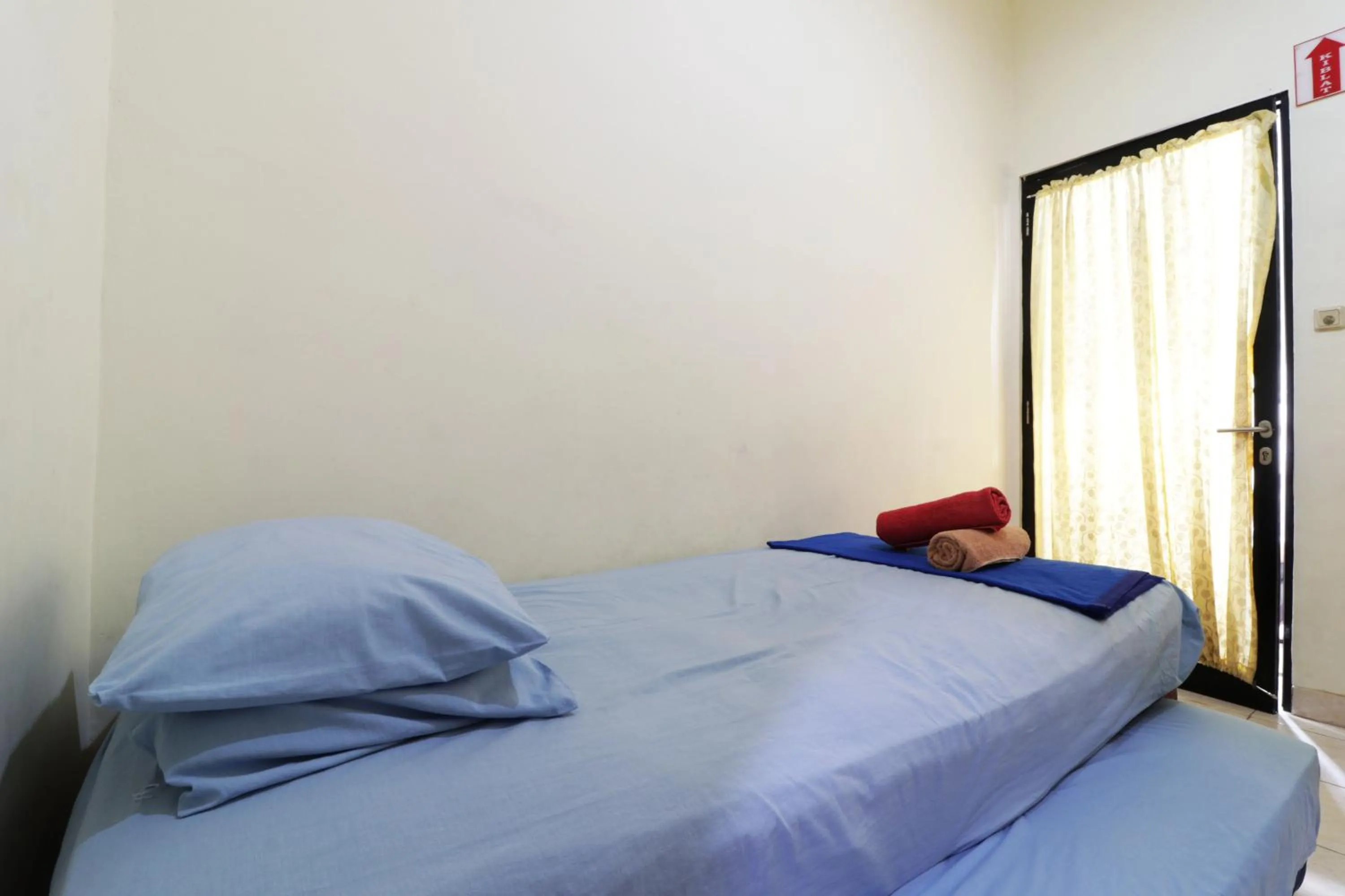 Bed in Penginapan Marsya Prima Syariah