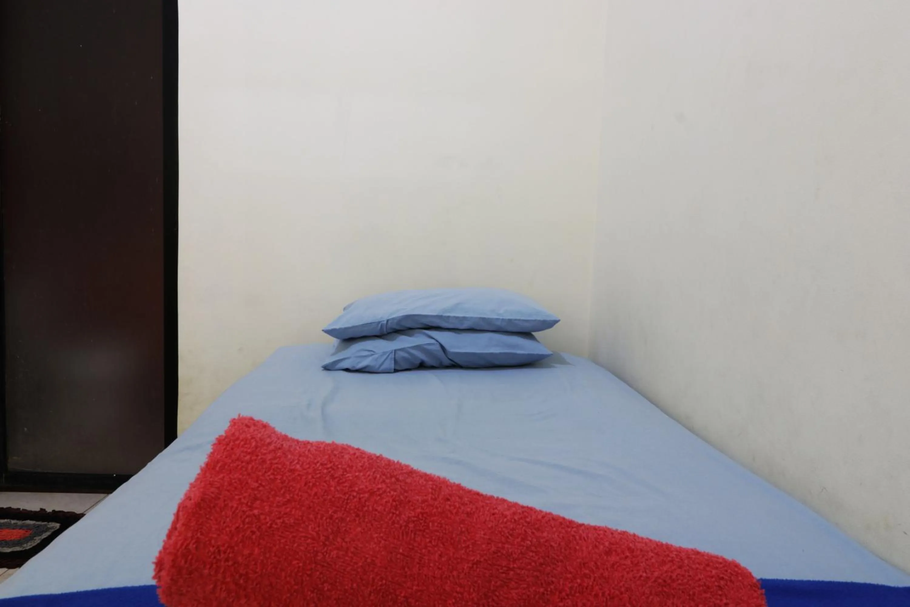 Bed in Penginapan Marsya Prima Syariah