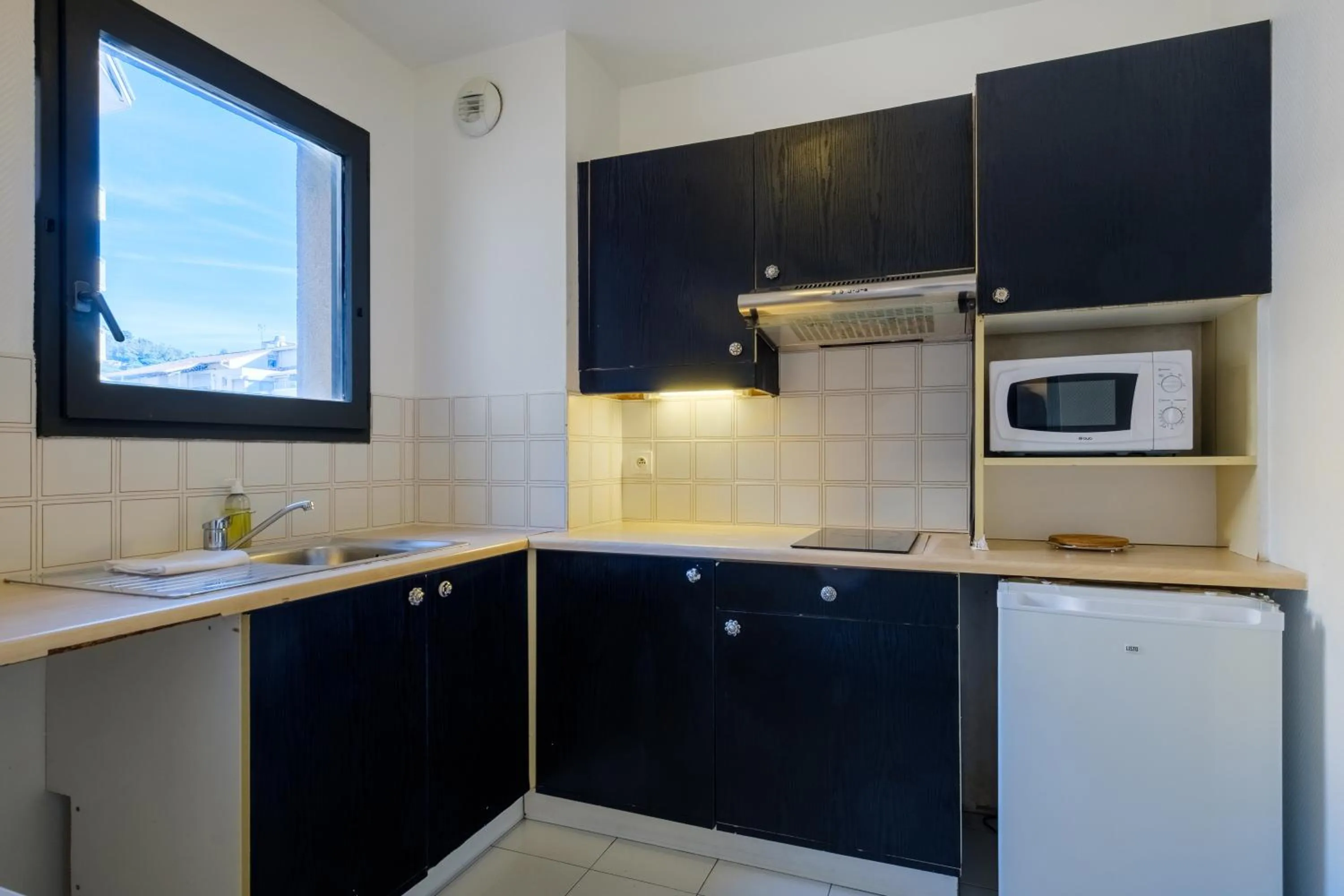 Kitchen or kitchenette in Residhotel Villa Maupassant