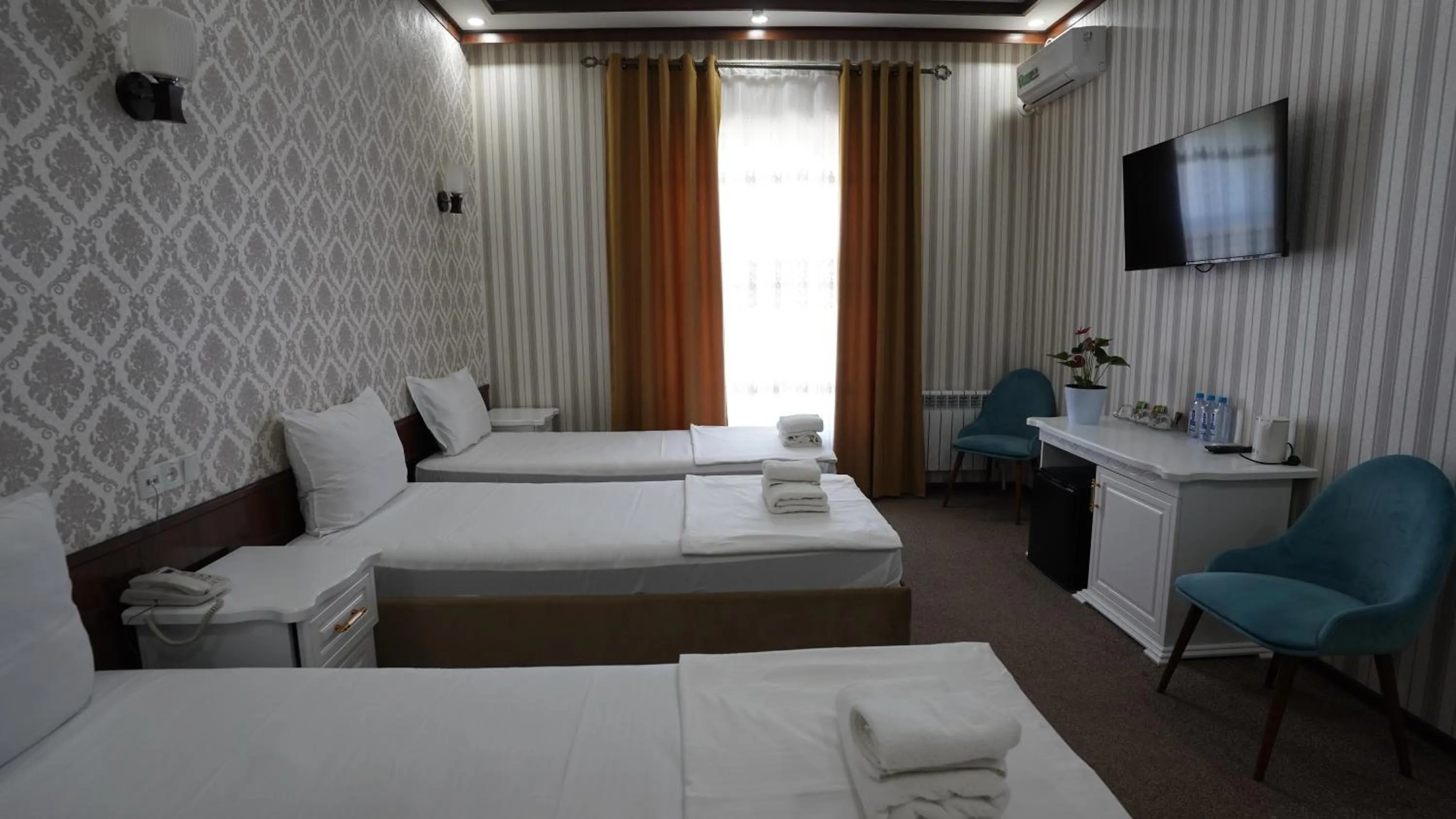 Bed in Hotel Khiva Palace