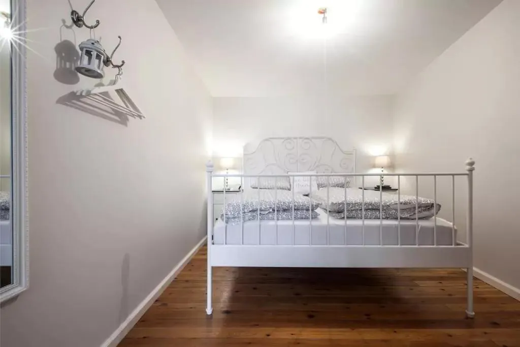 Bed in Grey Apartments