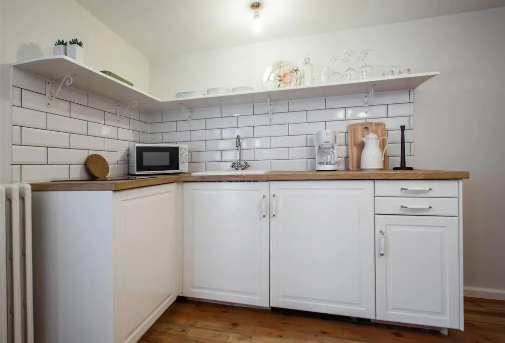 Kitchen or kitchenette in Grey Apartments