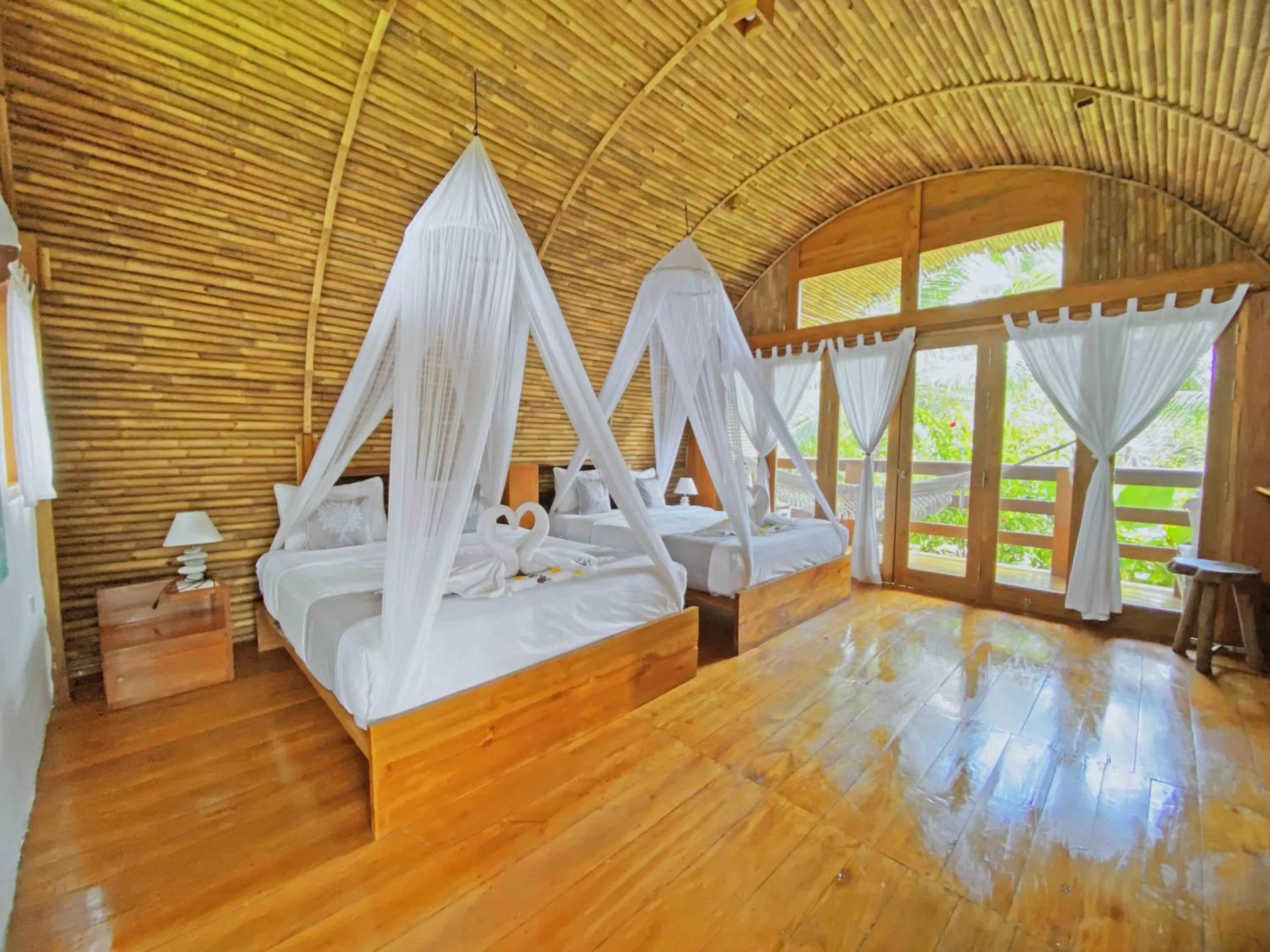Photo of the whole room, Bed in Lagoona Beach Bungalows - Eco Bungalows Batukaras