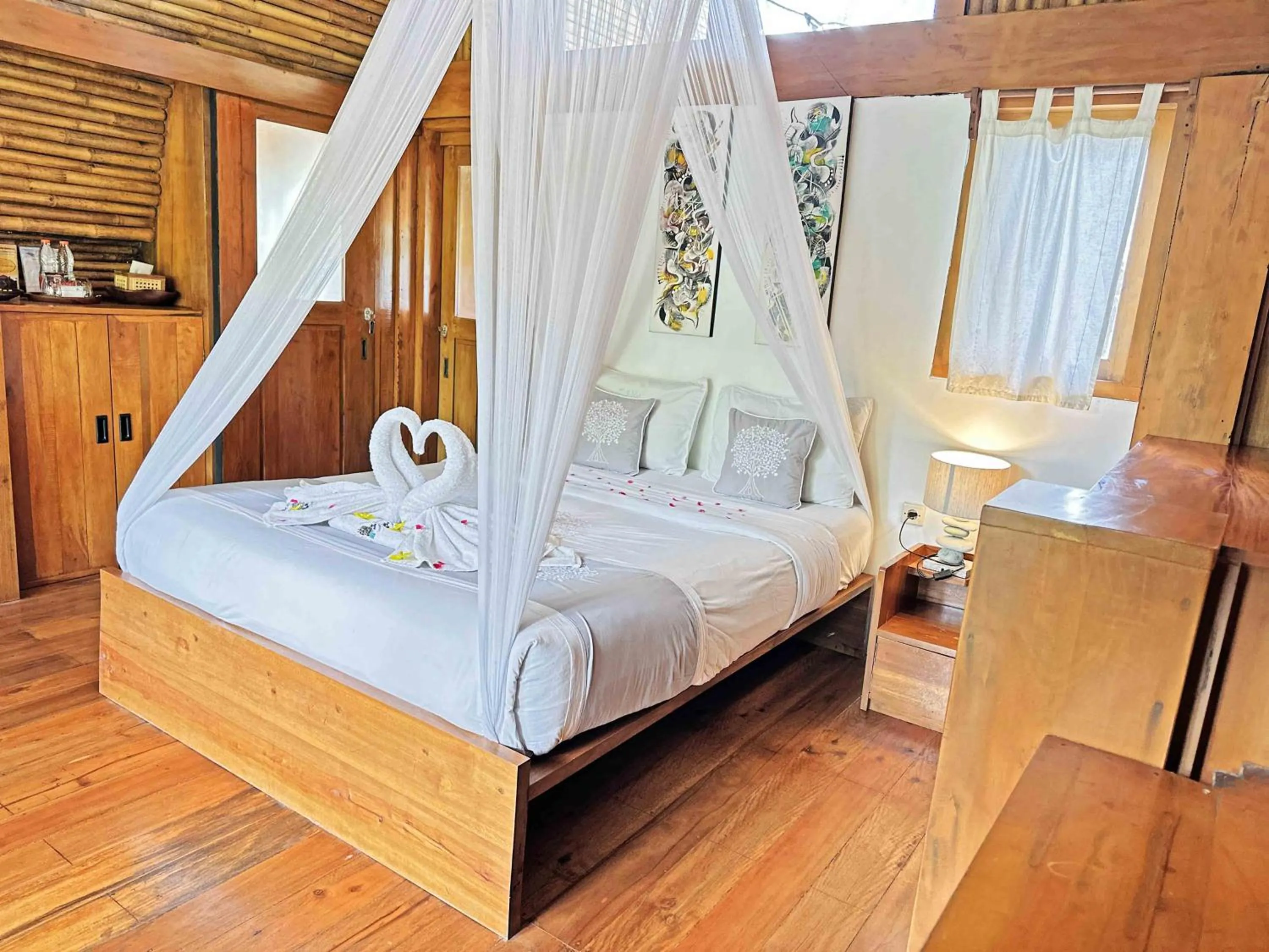 Photo of the whole room, Bed in Lagoona Beach Bungalows - Eco Bungalows Batukaras