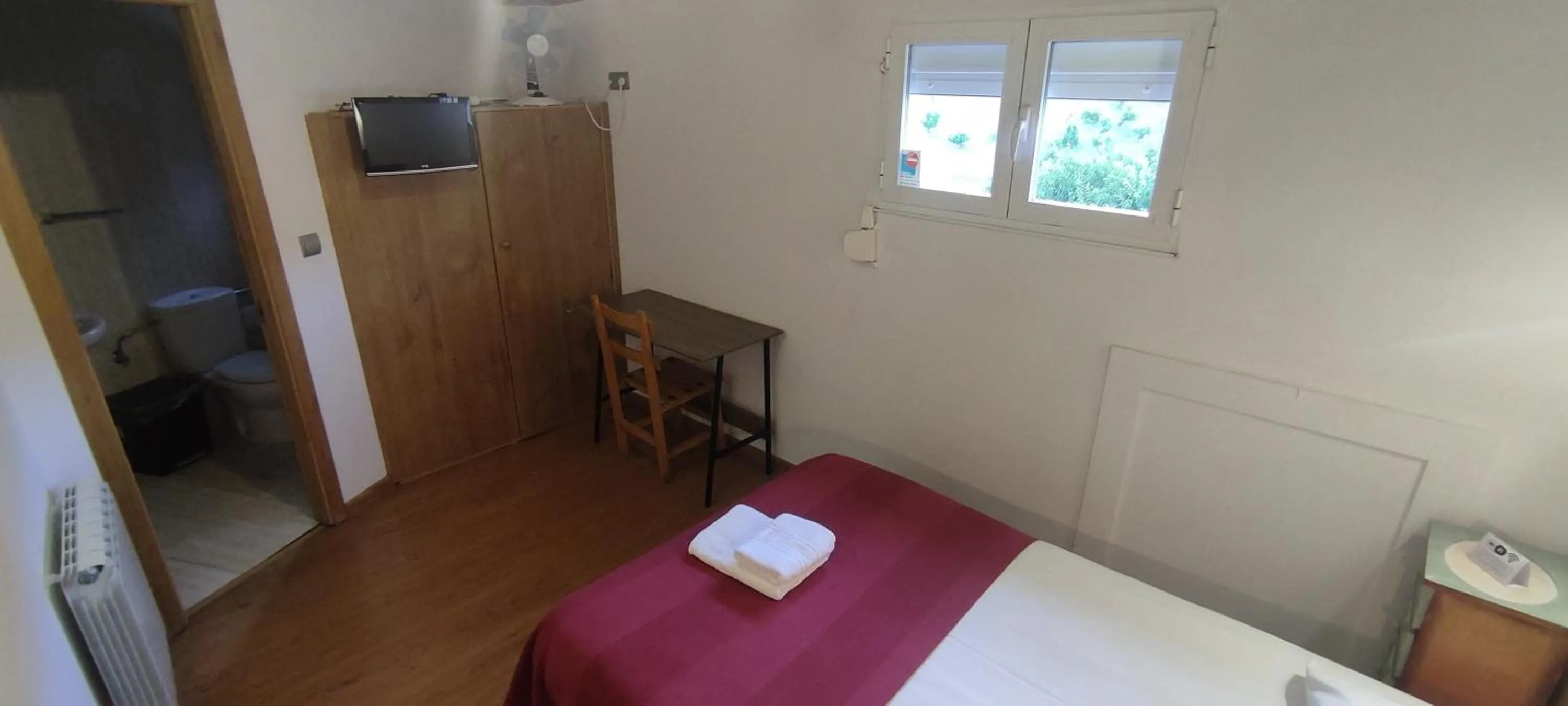 Bed in Hostal Cruce