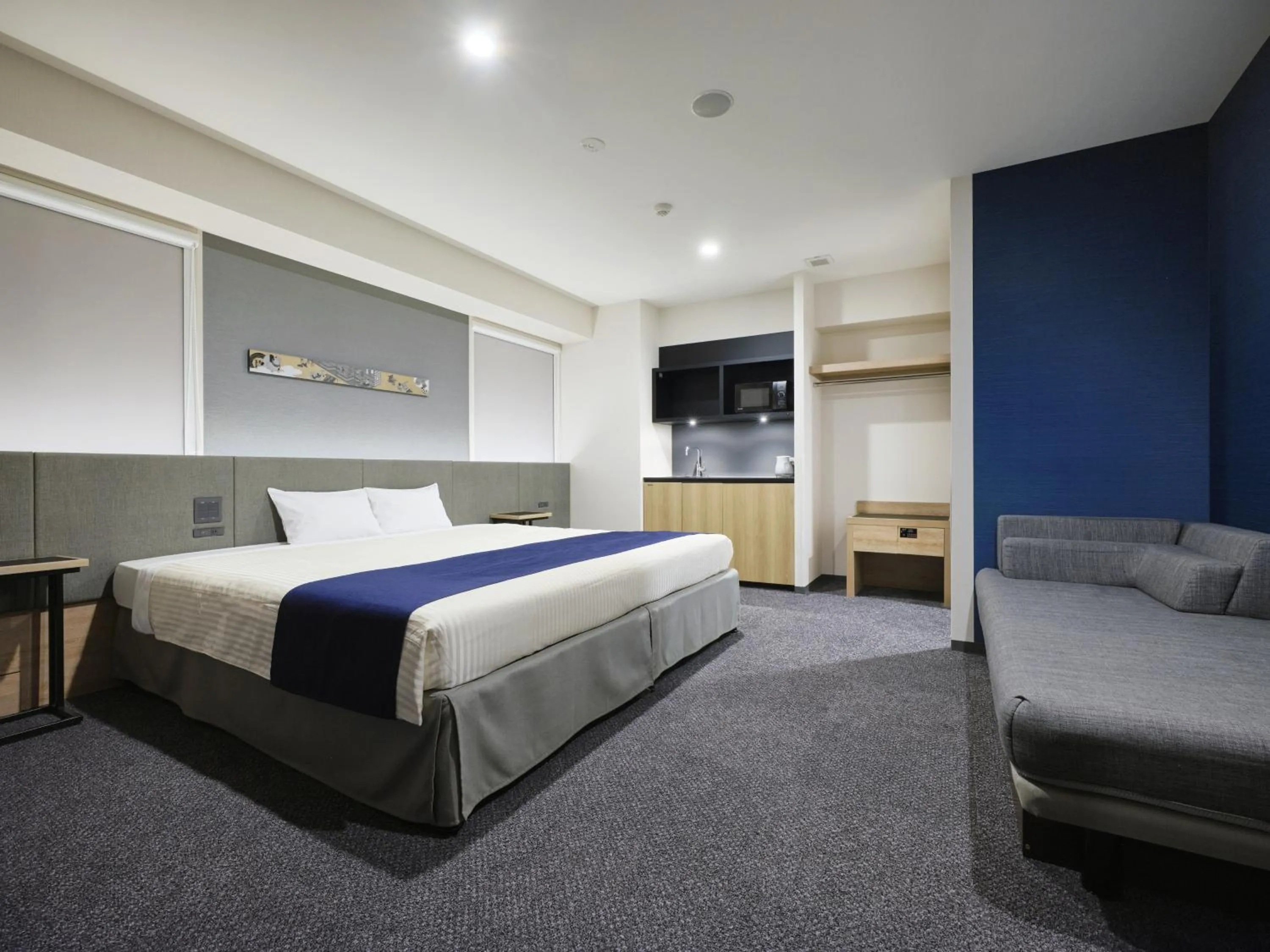 Bed in hotel MONday Premium Ueno Okachimachi