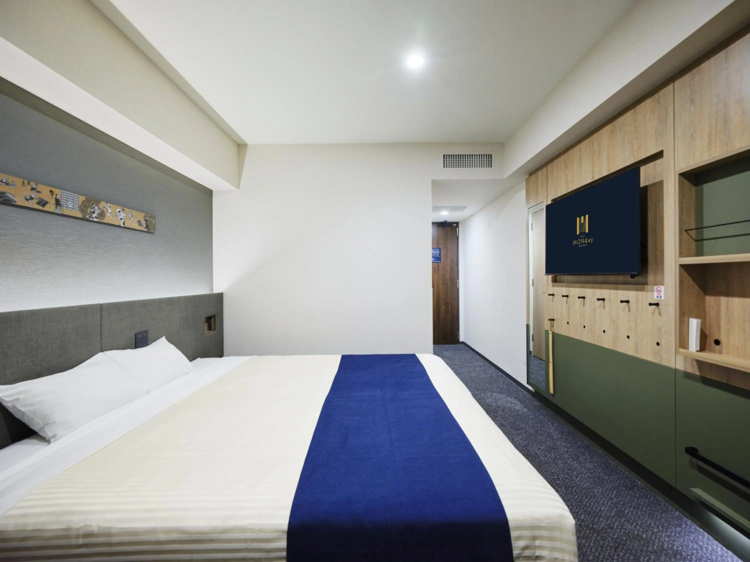 Bed in hotel MONday Premium Ueno Okachimachi