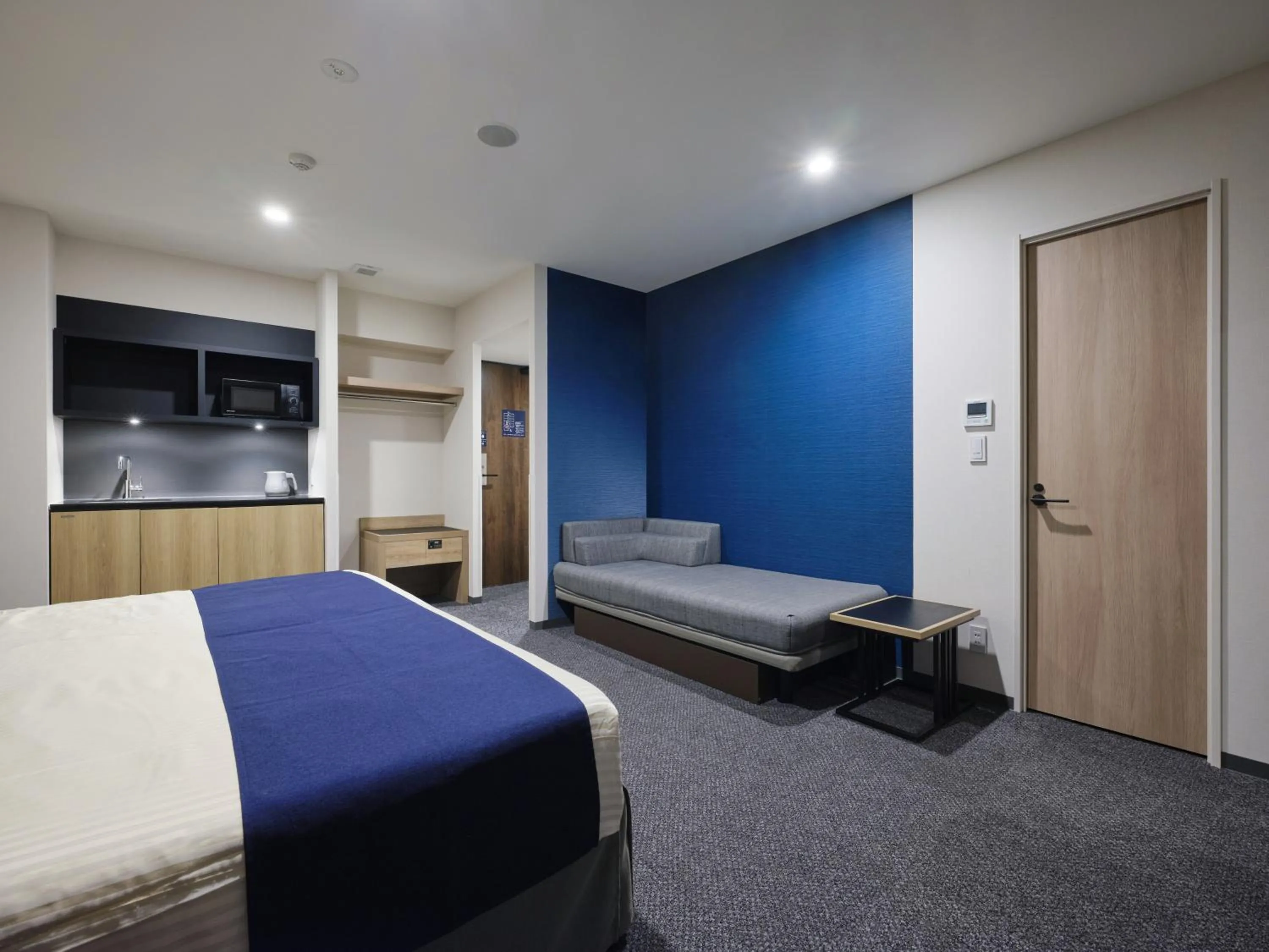 Bed in hotel MONday Premium Ueno Okachimachi