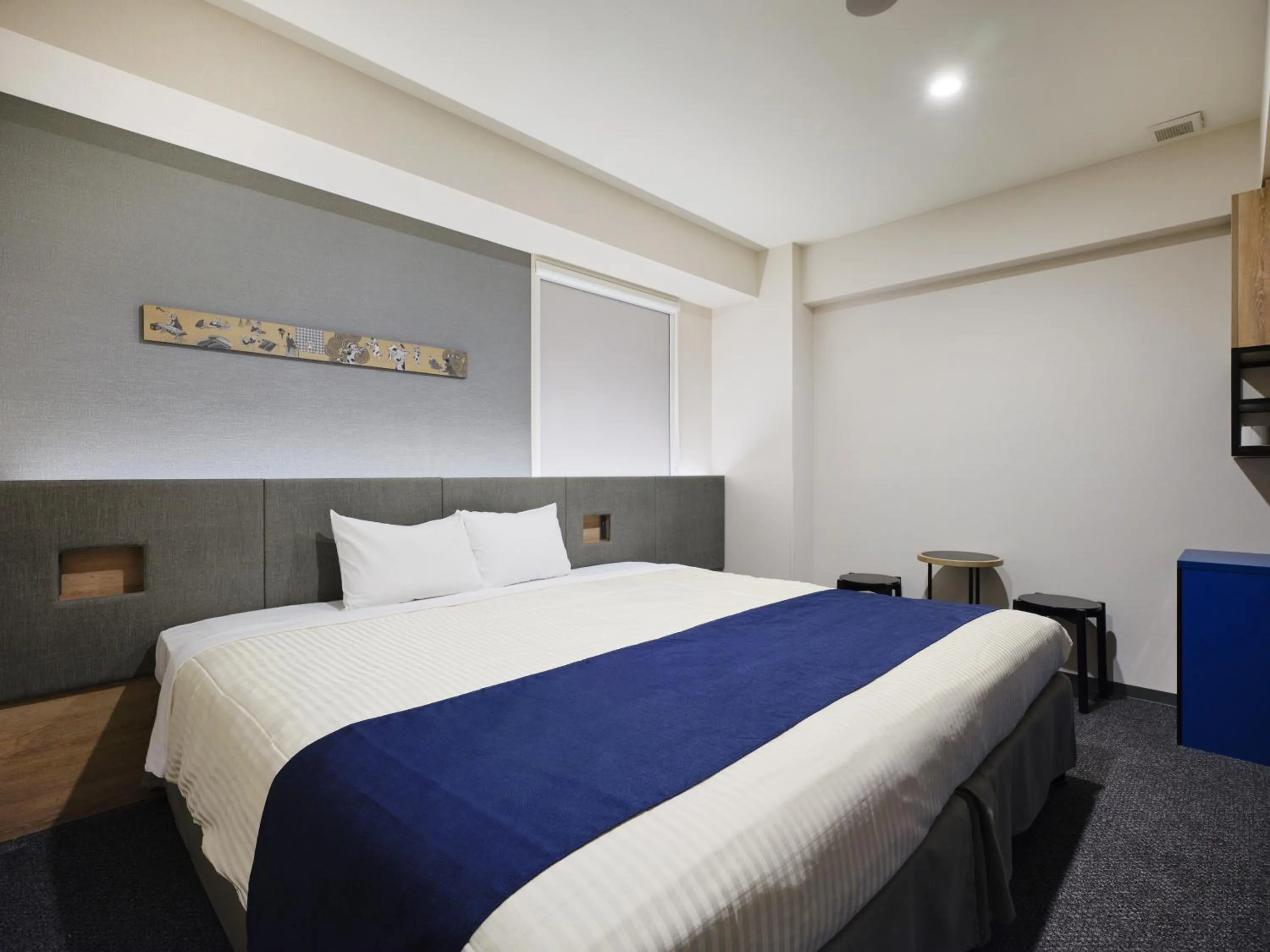 Bed in hotel MONday Premium Ueno Okachimachi