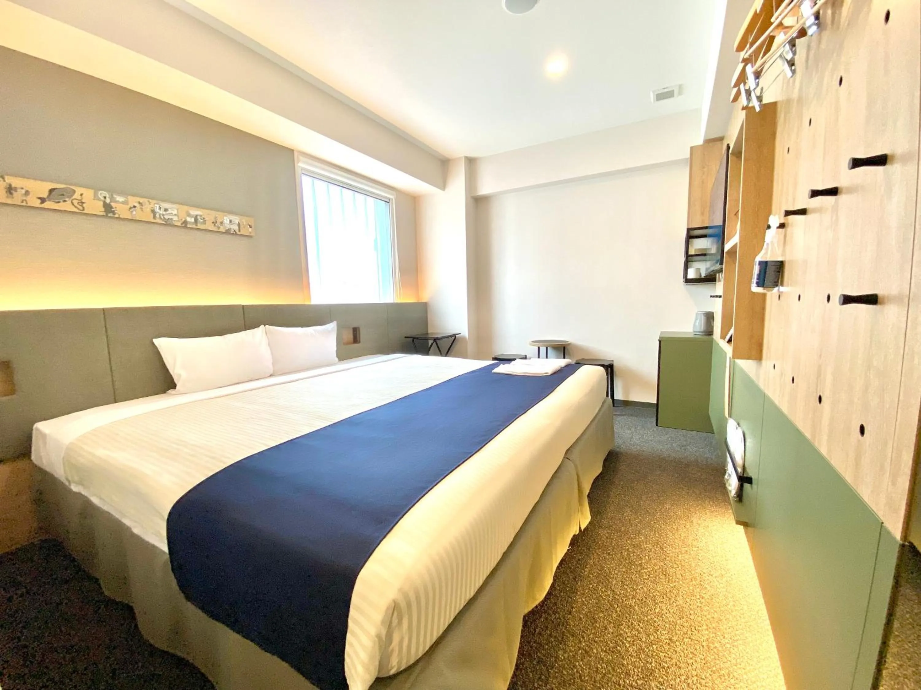 Bed in hotel MONday Premium Ueno Okachimachi