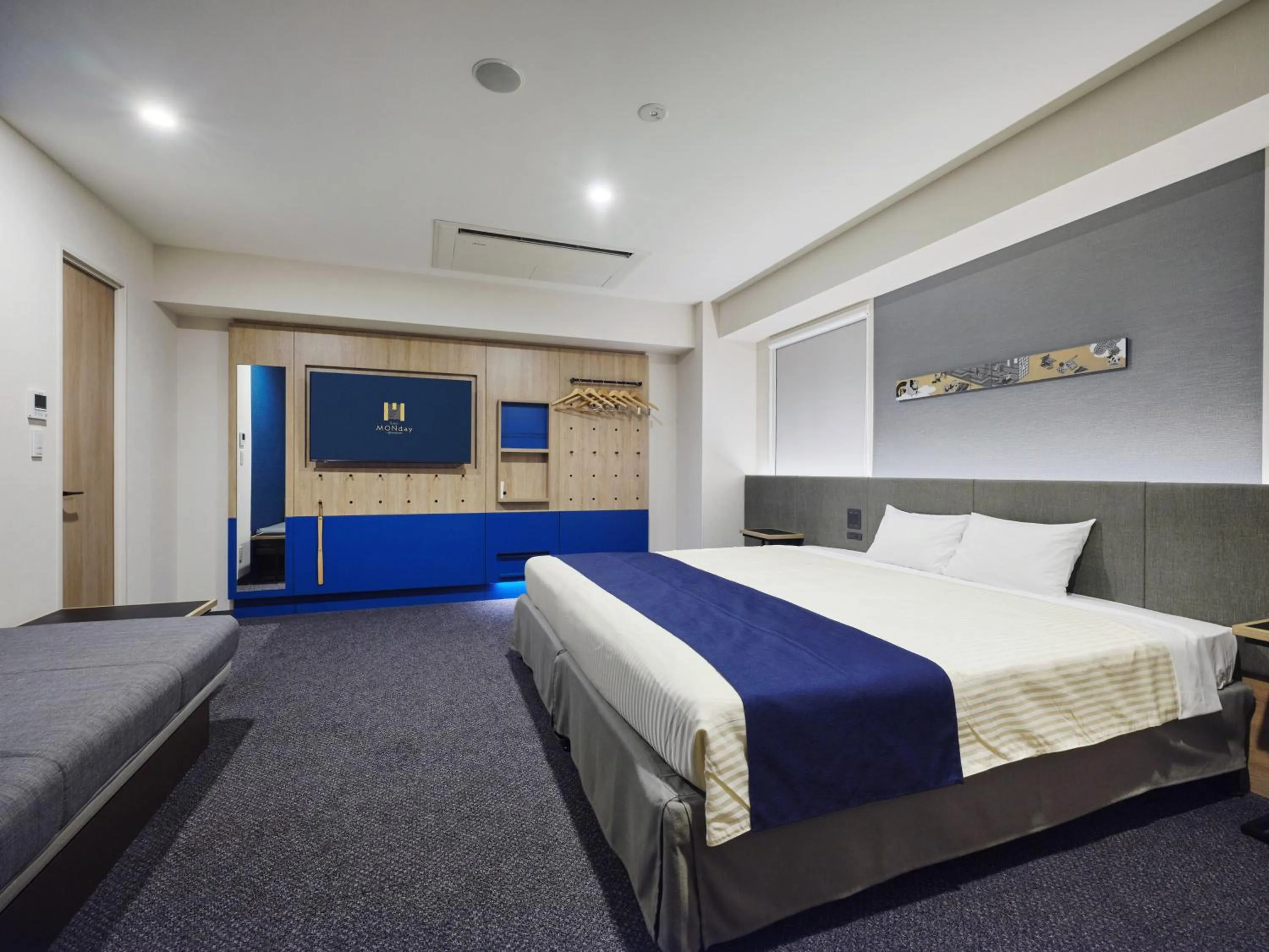 Bed in hotel MONday Premium Ueno Okachimachi