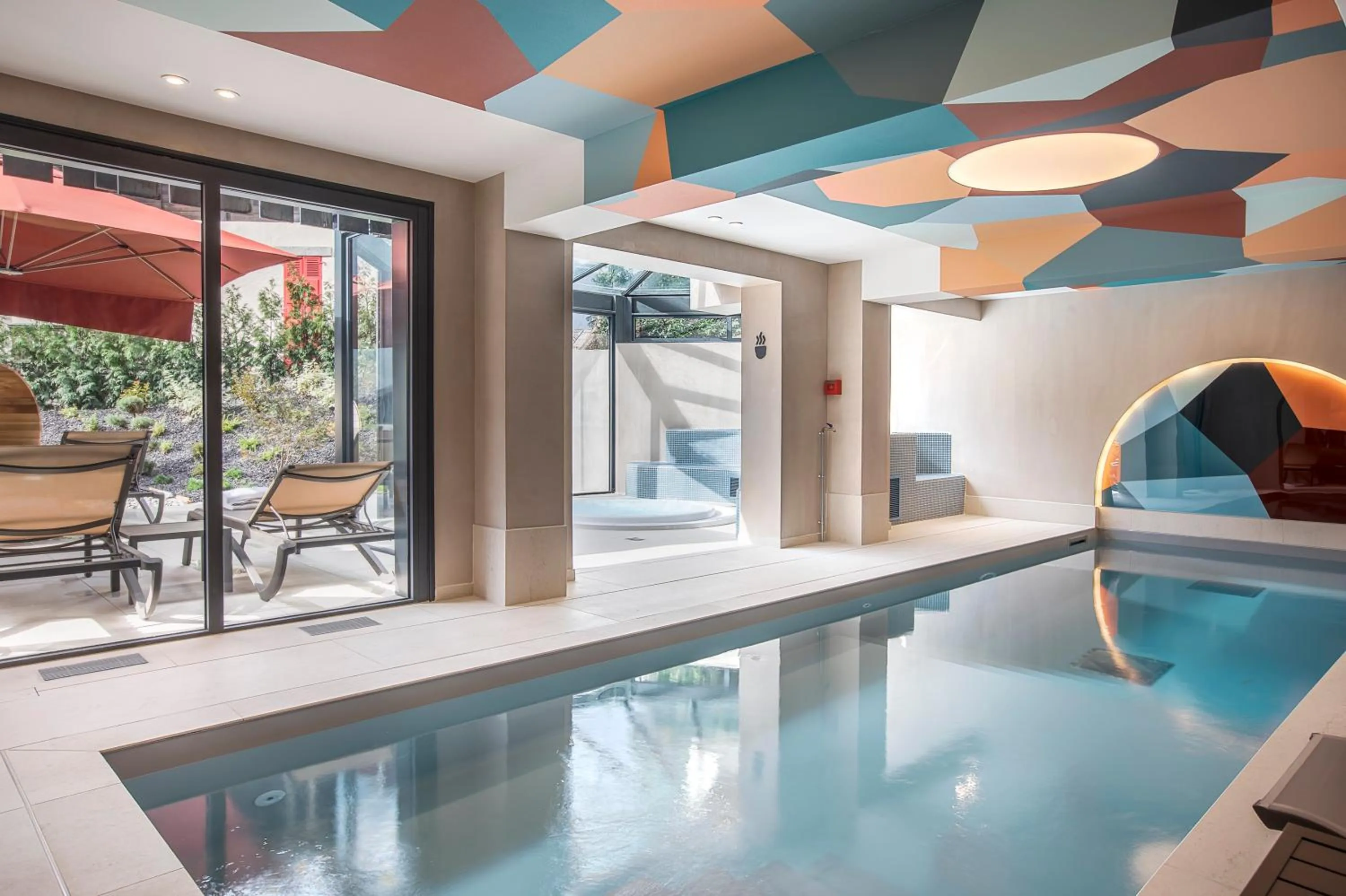 Swimming pool in Chalet Hôtel Le Prieuré & Spa