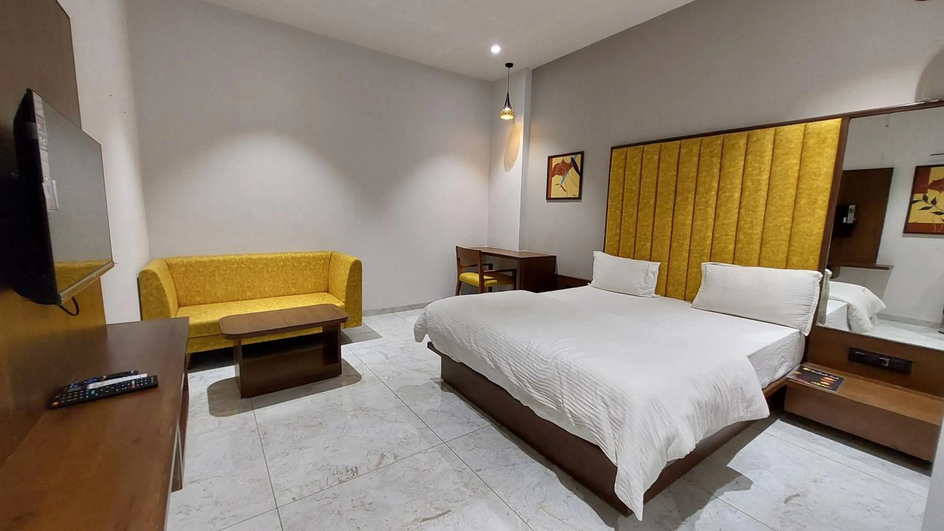 Seating area, Bed in Hotel Sparsh Inn - Chandkheda